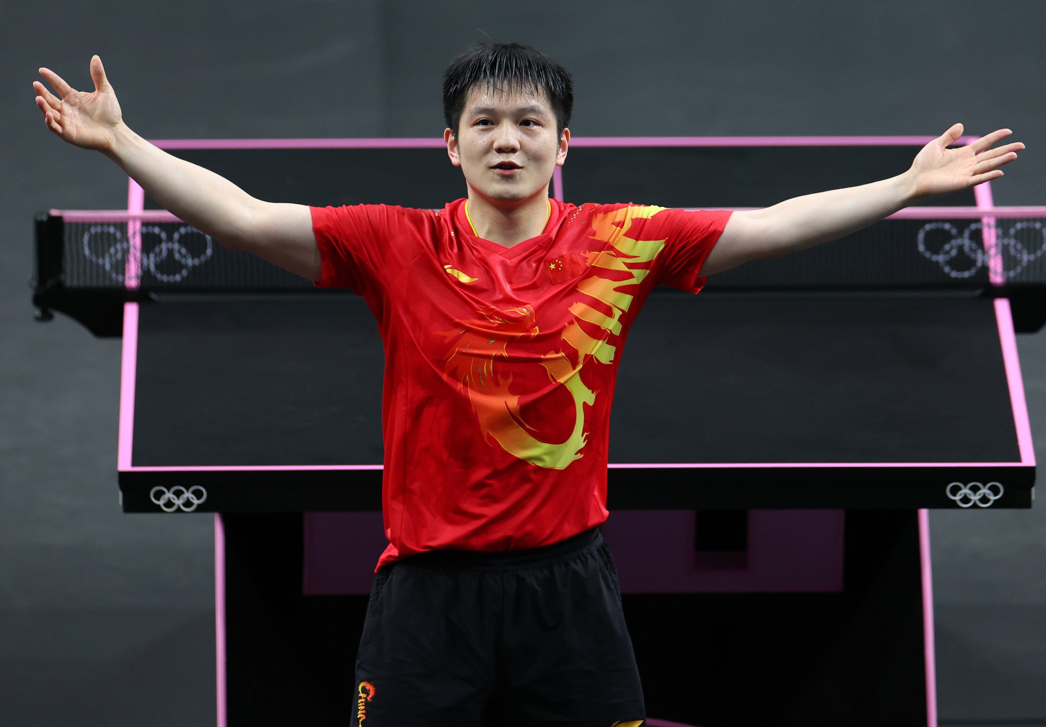 Fan Zhendong celebrates after winning a gold medal, which saw him complete a grand slam in table tennis. Photo: Xinhua