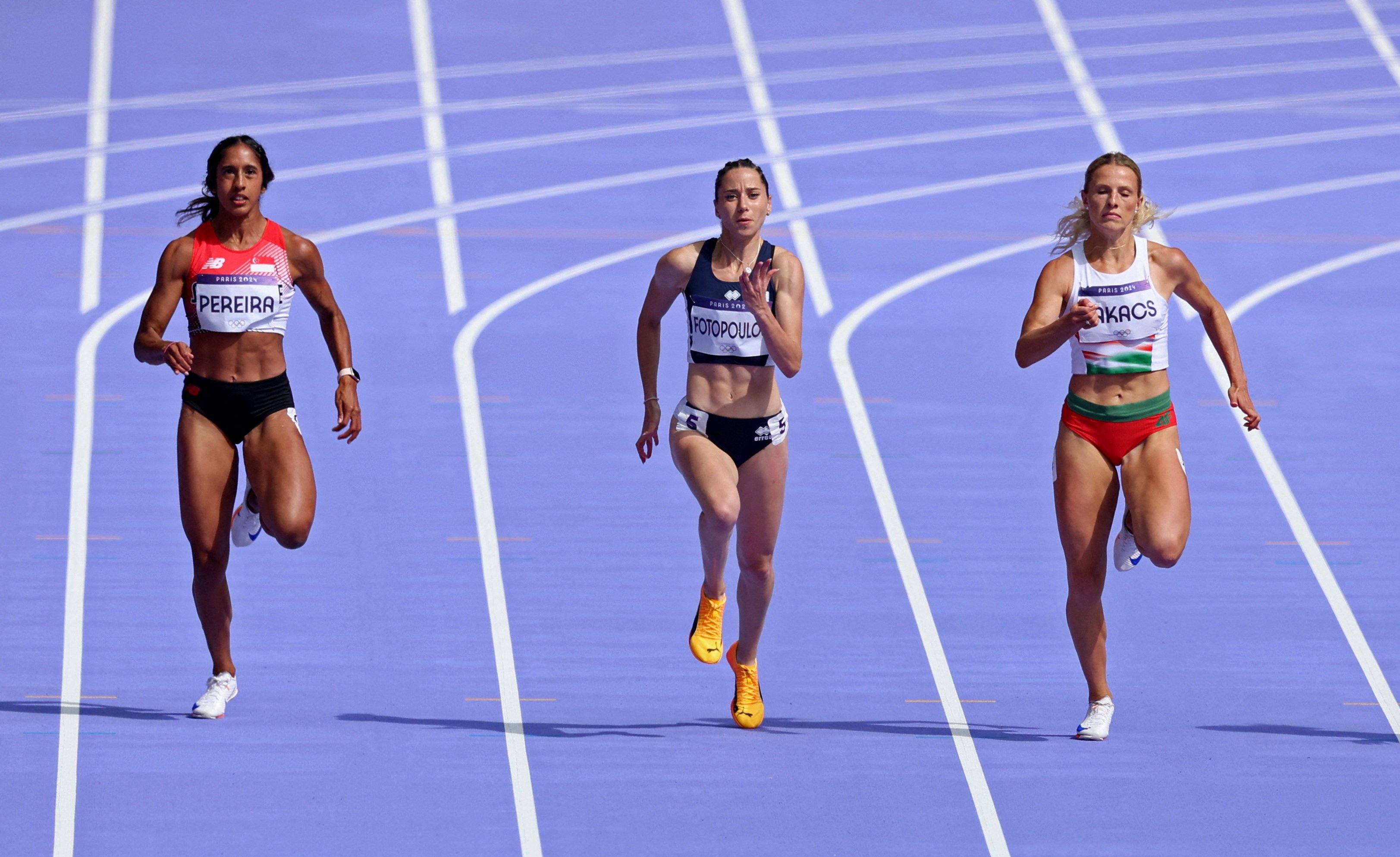 Shanti Pereira (left), Olivia Fotopoulou of Cyprus, and Boglarka Takacs of Hungary in action during Heat 5 of the women’s 200m. Photo: Reuters