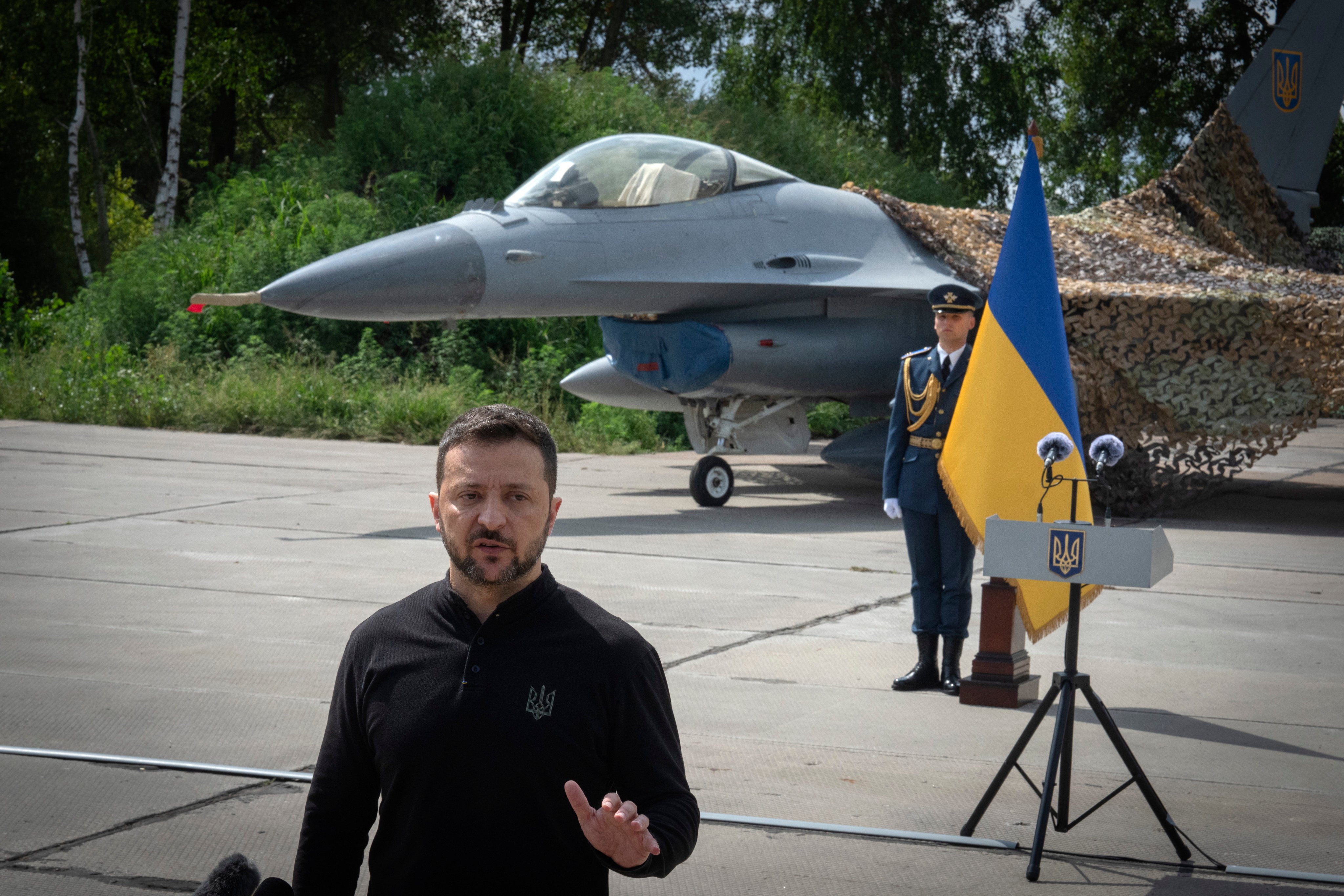 Ukraine’s President Volodymyr Zelensky and a Ukraine Air Force F-16 fighter jet. Photo: AP