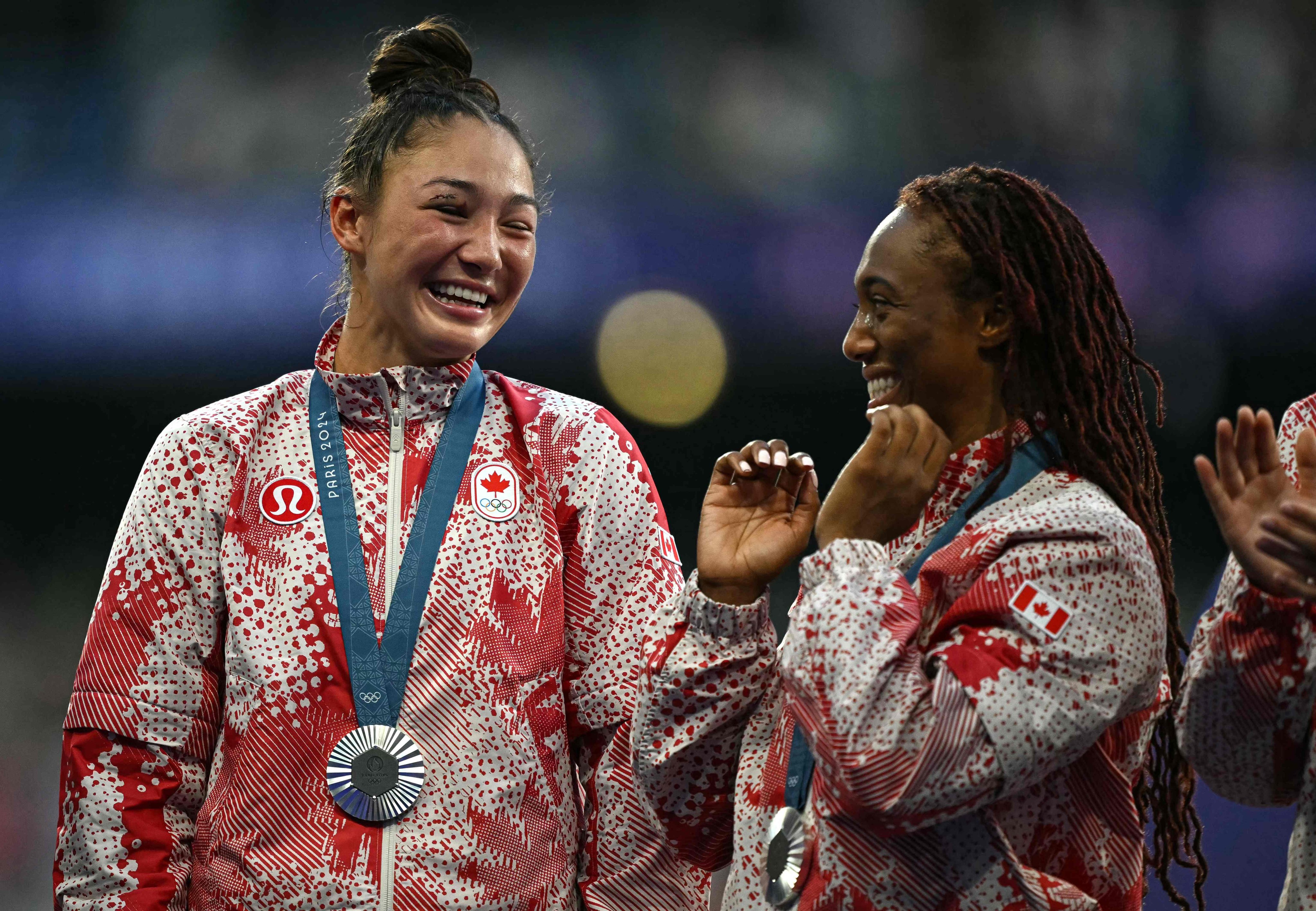 Florence Symonds (left) on the podium with teammate Charity Williams. Photo: AFP