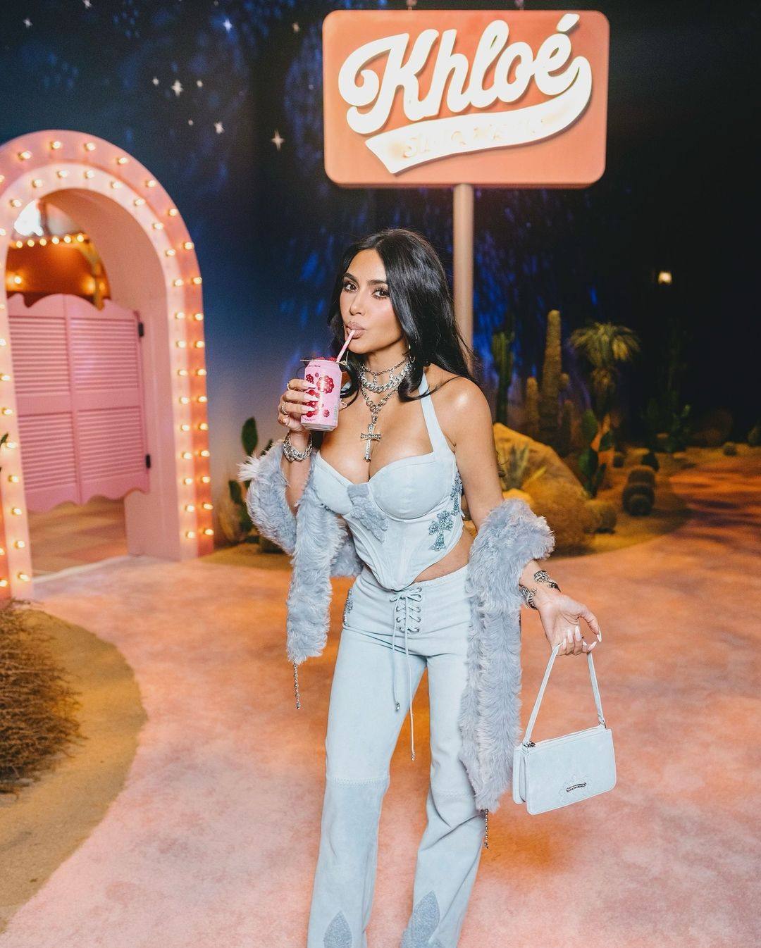 Kim Kardashian drinking a Poppi soda at sister Khloe’s birthday in June 2024