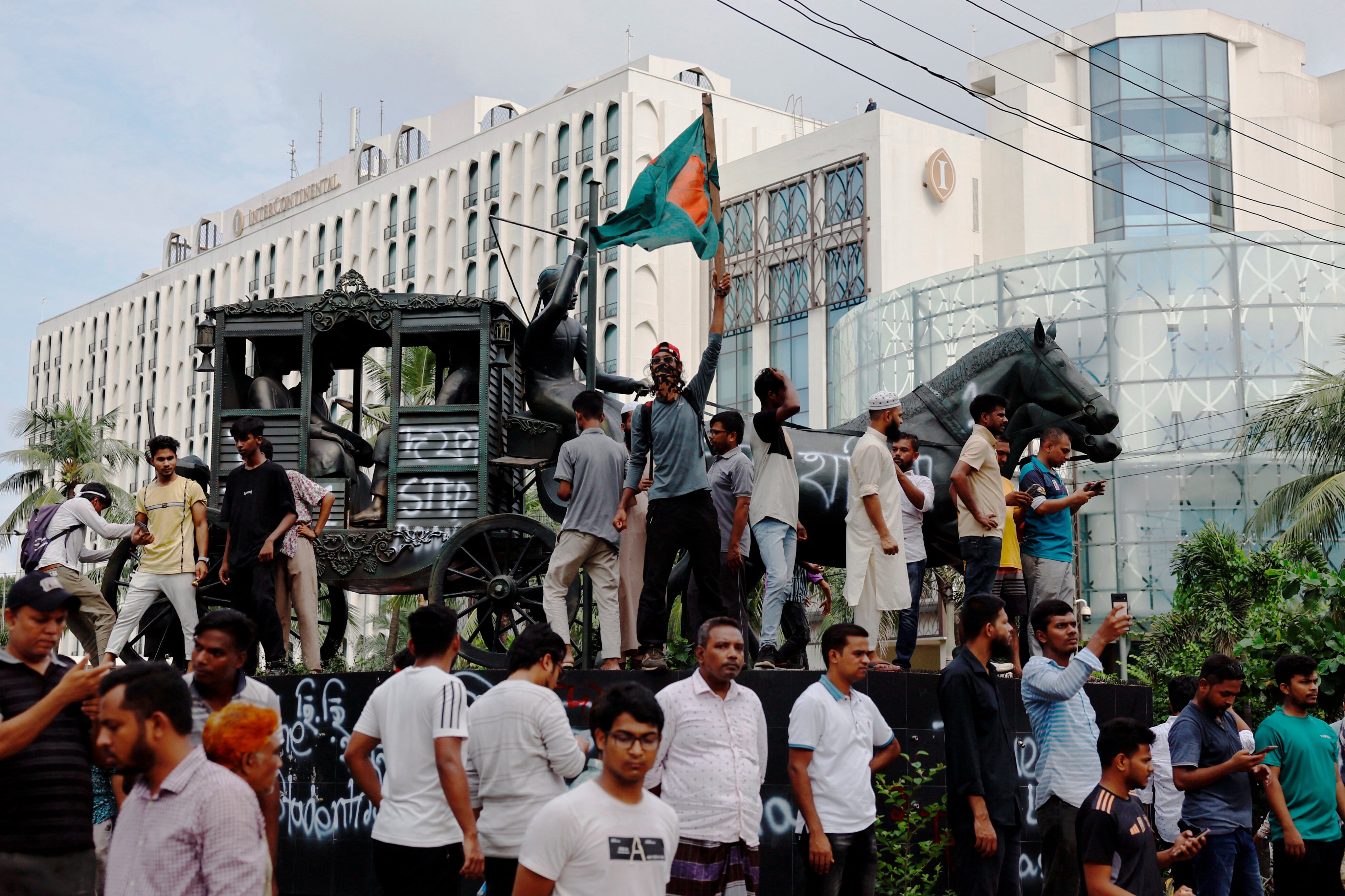 Members of the public celebrate the resignation of prime minister Sheikh Hasina in Dhaka, Bangladesh, on Monday. Photo: Reuters