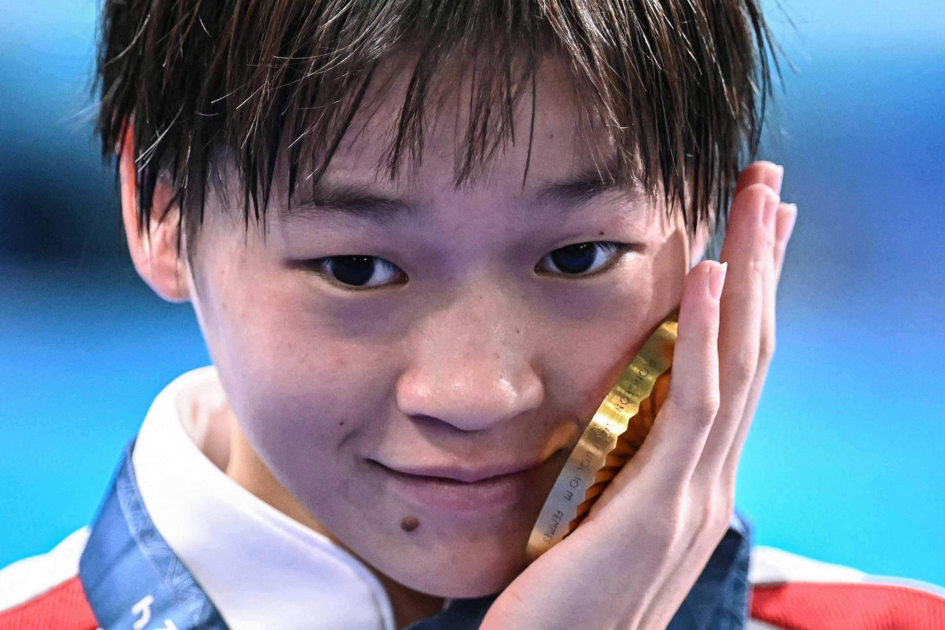 China’s Quan Hongchan poses with her gold medal after the women’s 10m platform diving final. Photo: AFP