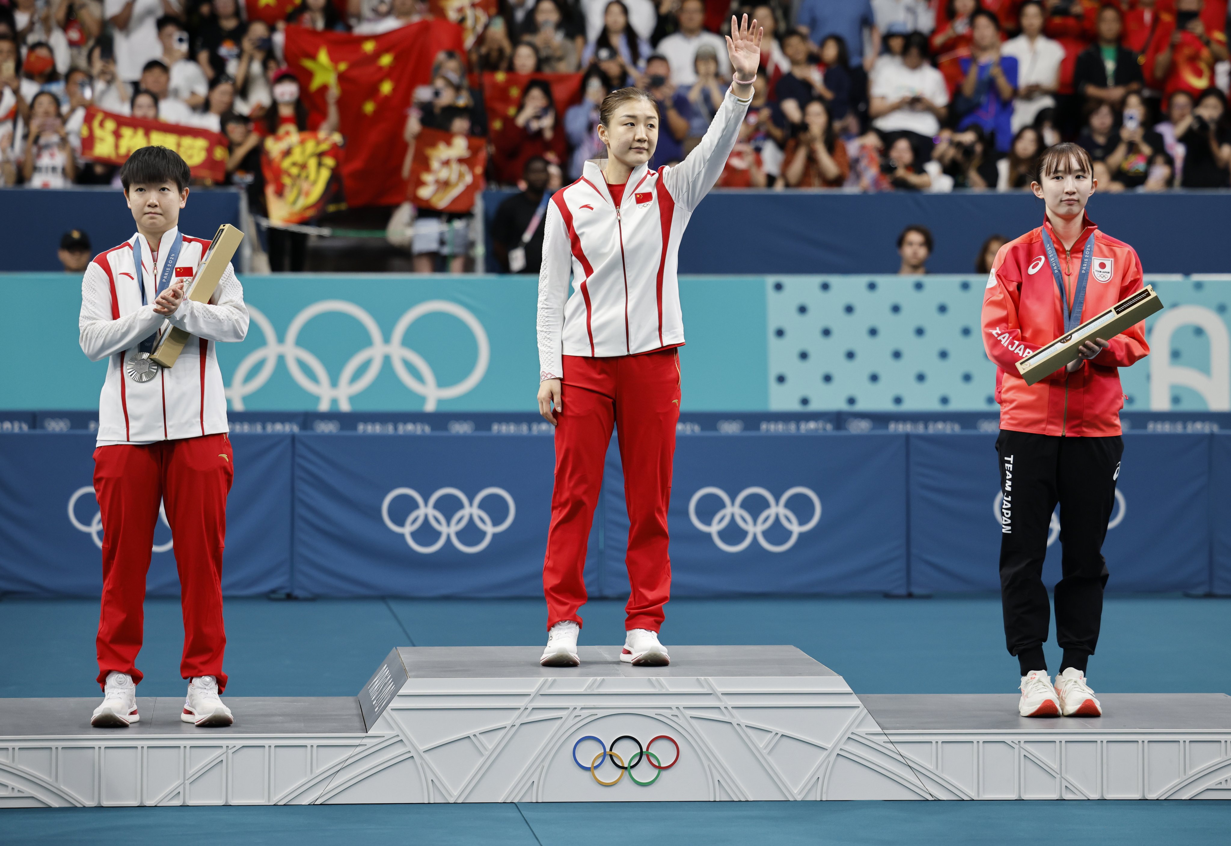 From left, table tennis players Sun Yingsha of China, Chen Meng of China and Shin Yu-bin of South Korea stand on the winner’s podium at the Paris Olympics on August 3. Photo: EPA-EFE