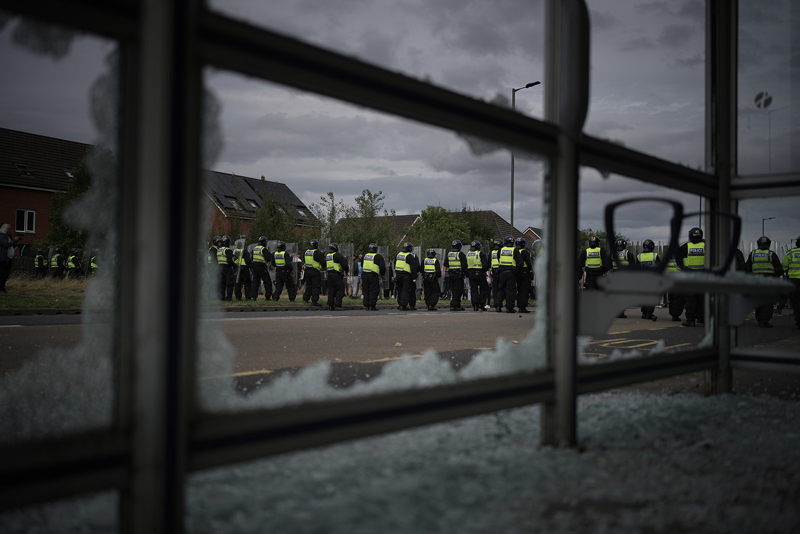 Riot police push back anti-migration protesters in Rotherham on Sunday. Photo: TNS