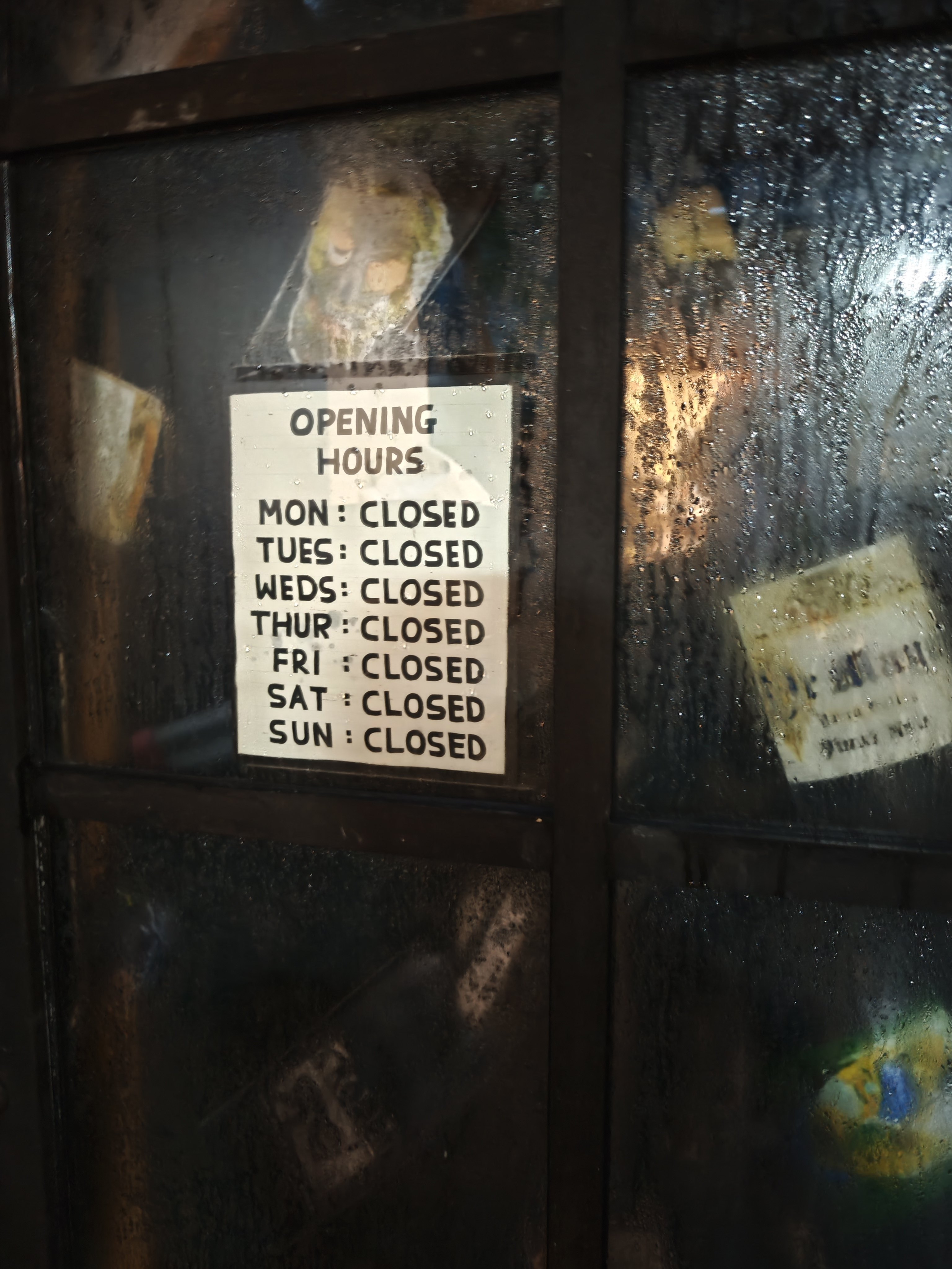 The door to the now-shuttered Oz Terroirs wine bar in Sheung Wan. The F&B industry is battling high costs, low-spending tourists and a tepid economic climate. Many restaurants and bars are closing as a result. Photo: Douglas Parkes