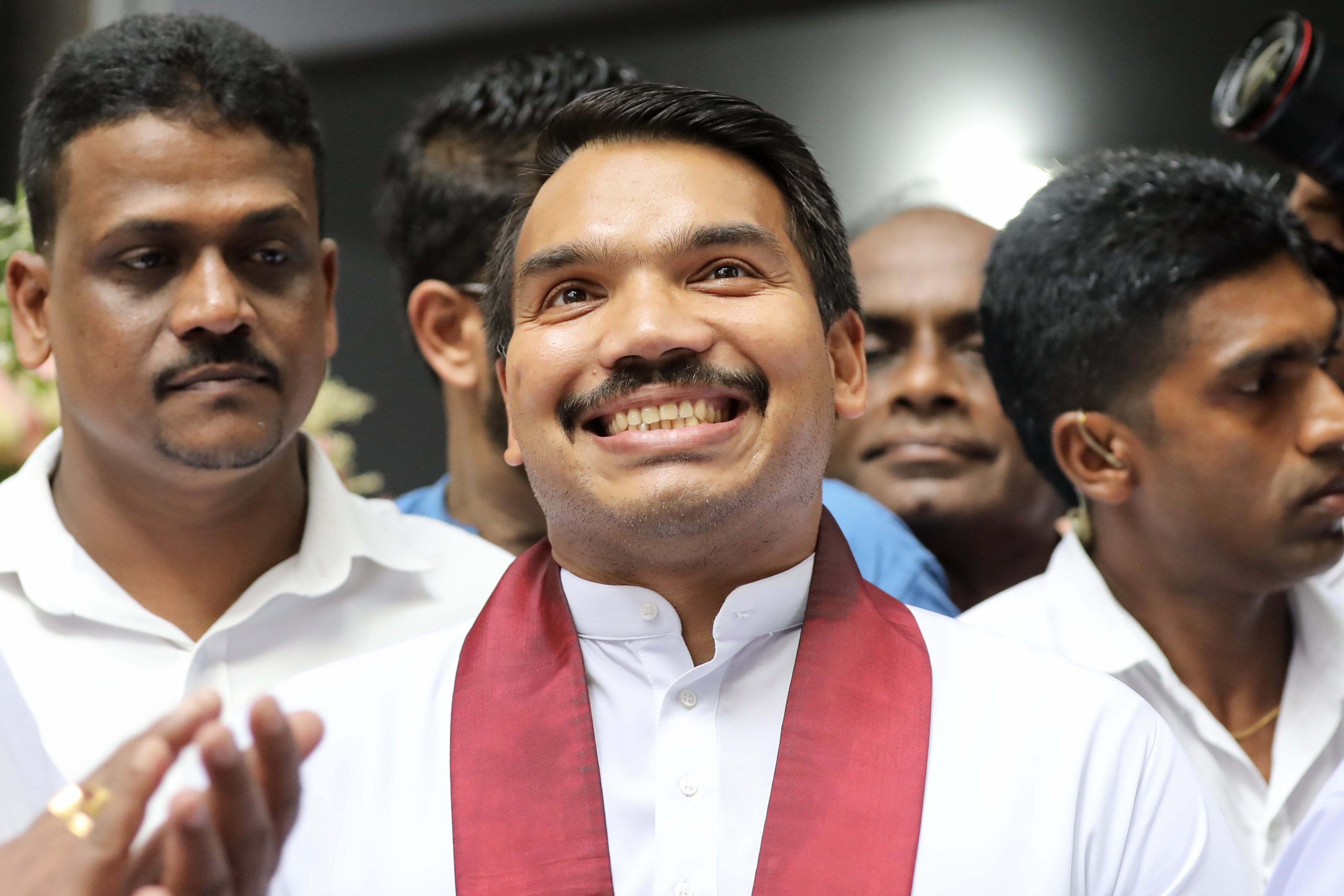 Namal Rajapaksa (centre), son of former Sri Lankan president Mahinda Rajapaksa, greets his supporters after being nominated by Sri Lanka’s ruling Podujana Peramuna party as their presidential candidate for the upcoming election. Photo EPA-EFE