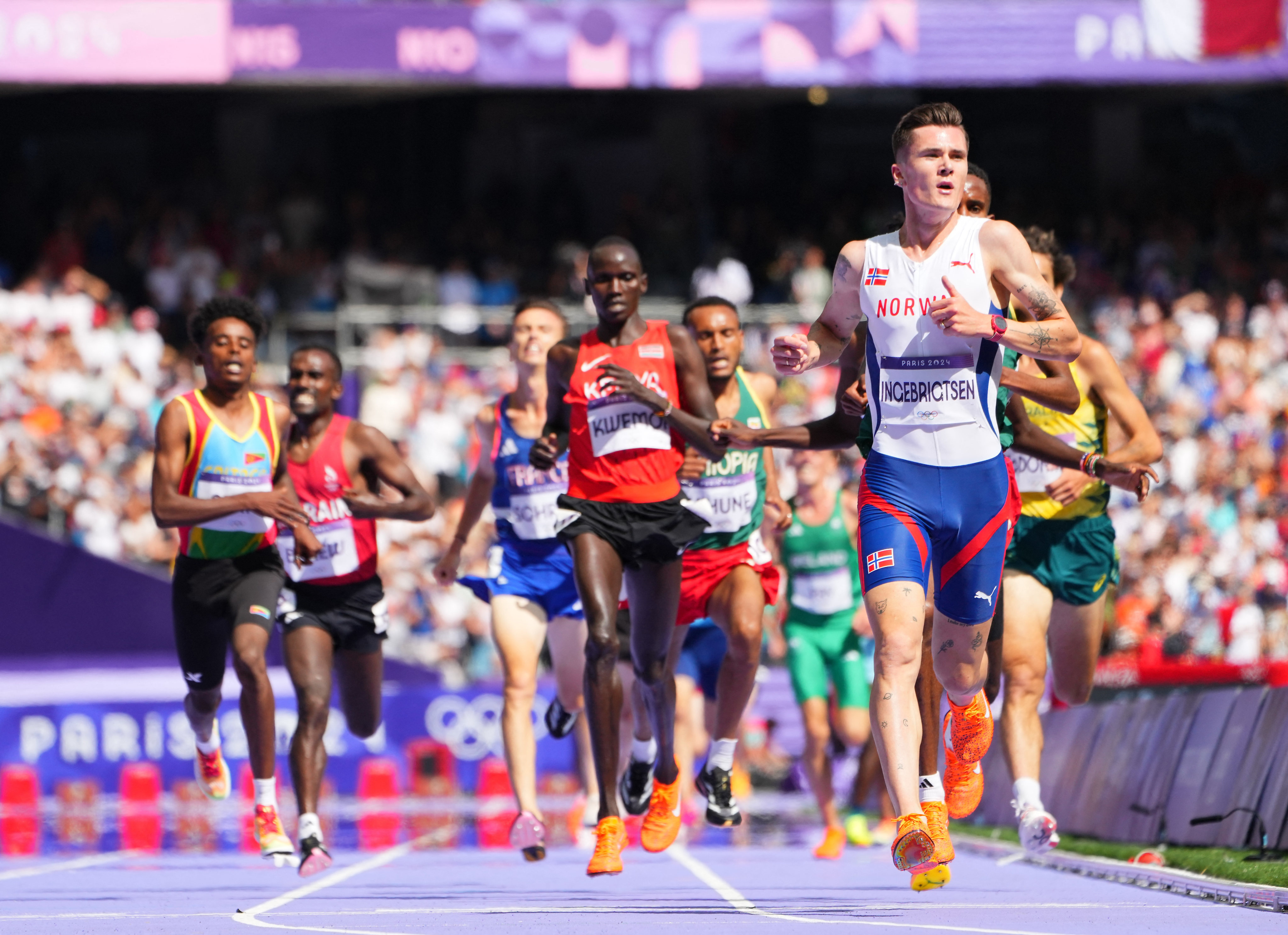 During the men’s 5000m heat, a cameraman casually crossed the track as the runners were approaching. Photo: Reuters