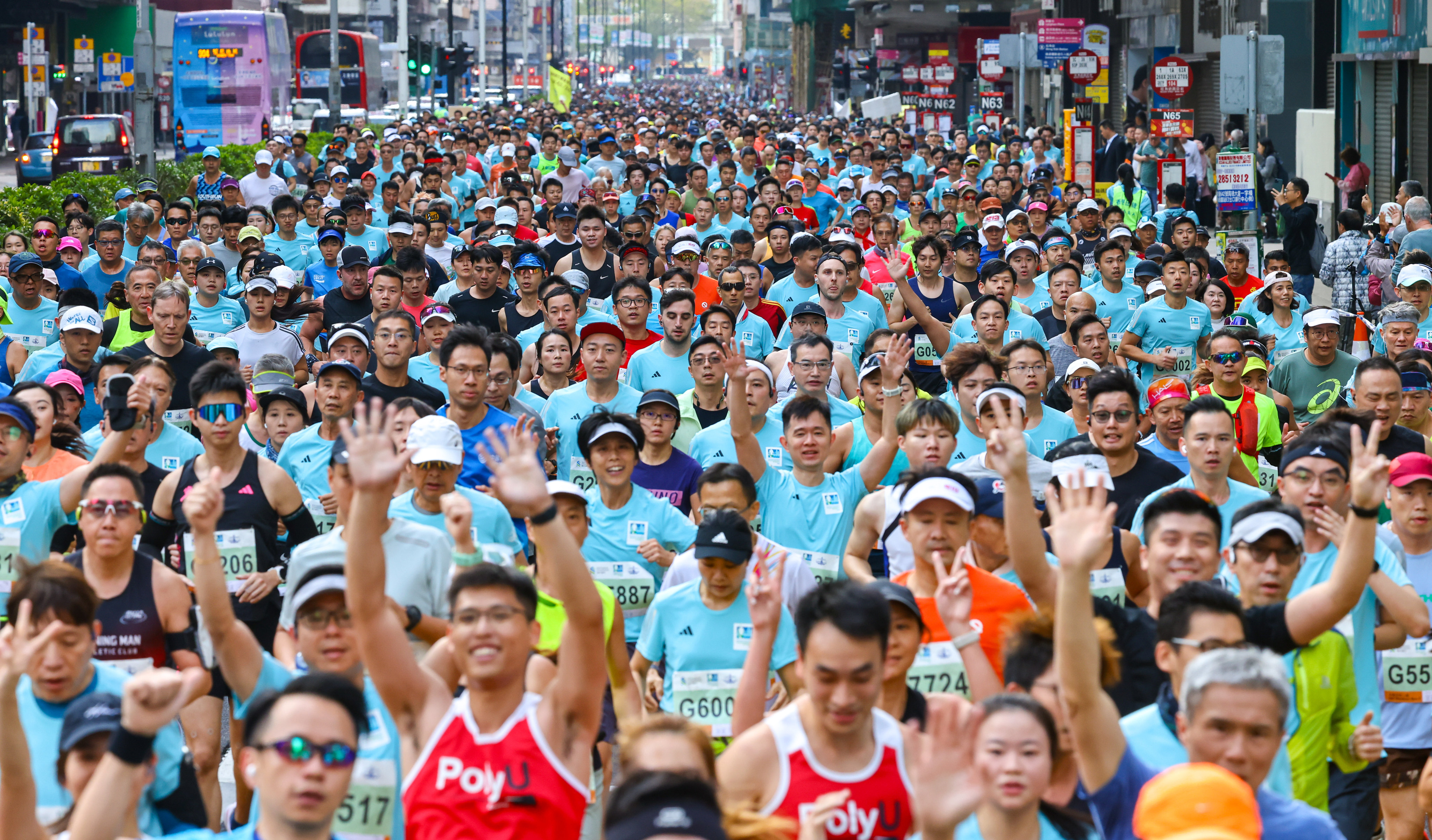 Participants run through Mongkok during the Standard Chartered Hong Kong Marathon in January. Photo: Dickson Lee