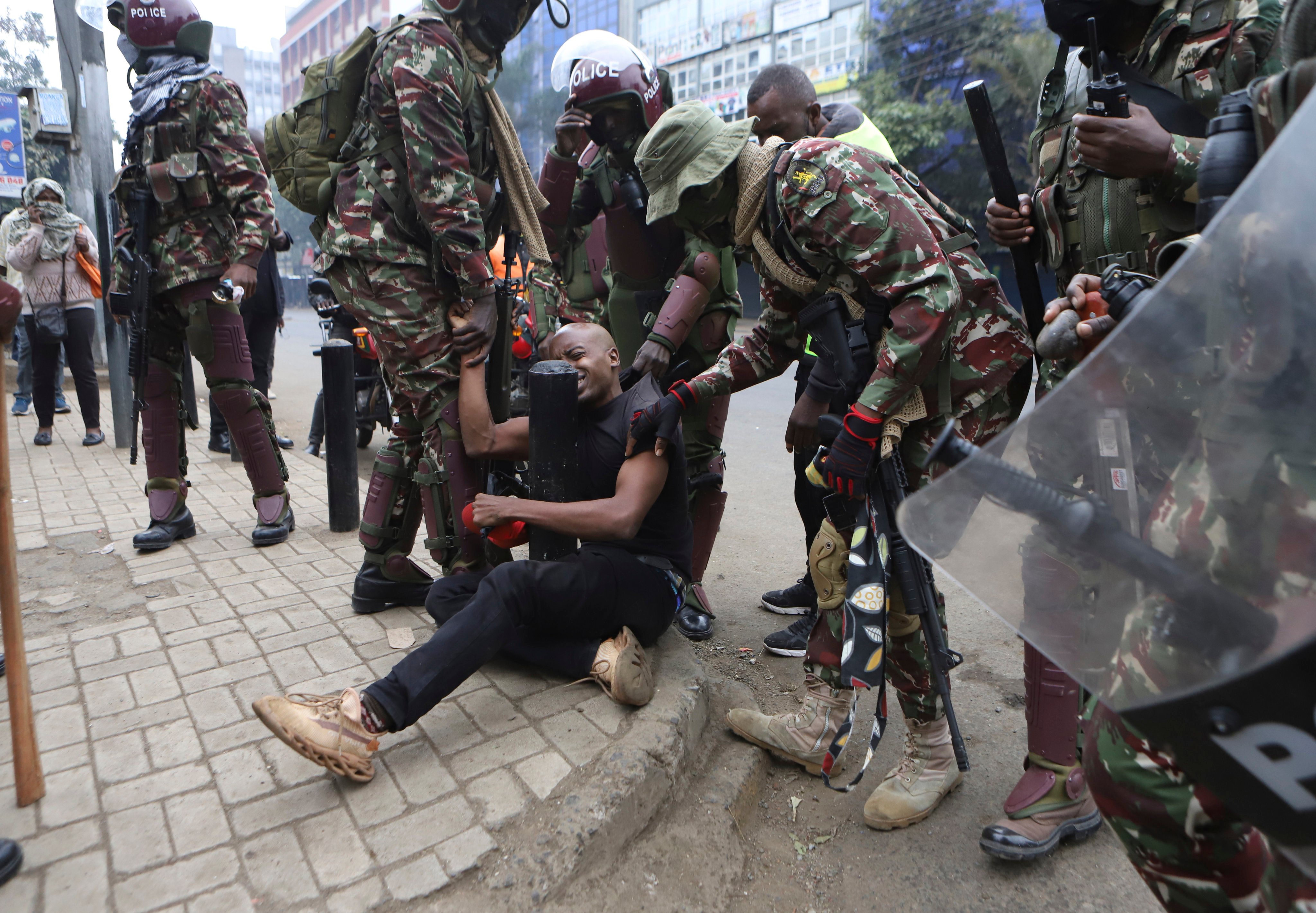 A protester is arrested in Nairobi. Protests in Kenya started on June 18 with initial calls for legislators to vote against a controversial finance bill that was proposing increased taxes amid the high cost of living. Photo: AP