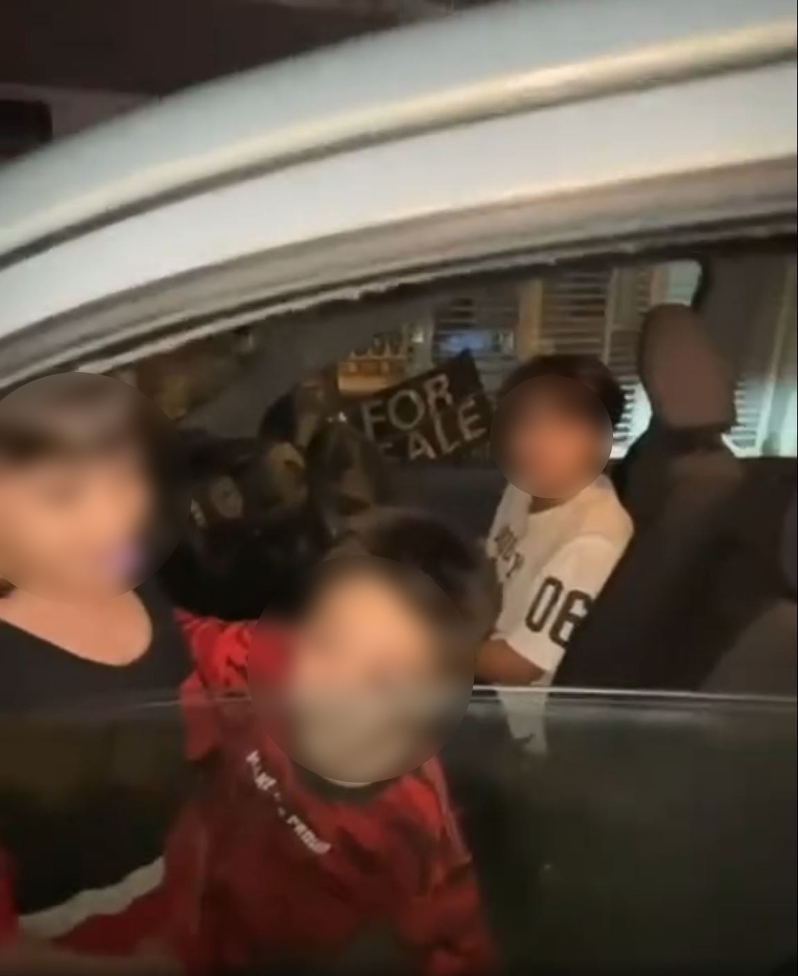An underage boy was caught on video driving a car with his two younger siblings in Malaysia. Photo: Facebook/JY Properties
