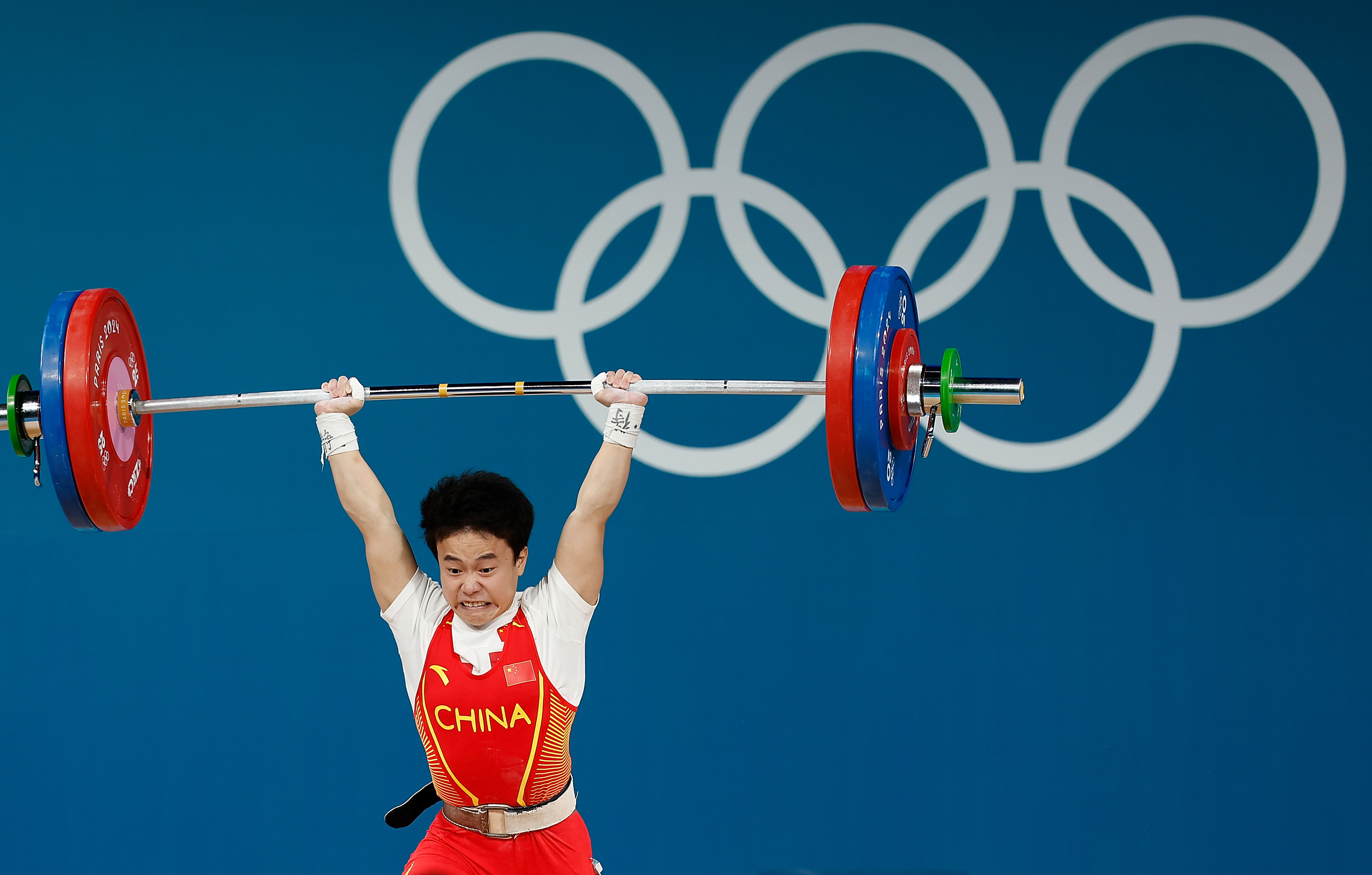 Hou Zhihui of China lifts her way to gold in the women’s 49kg competition. Photo: Xinhua