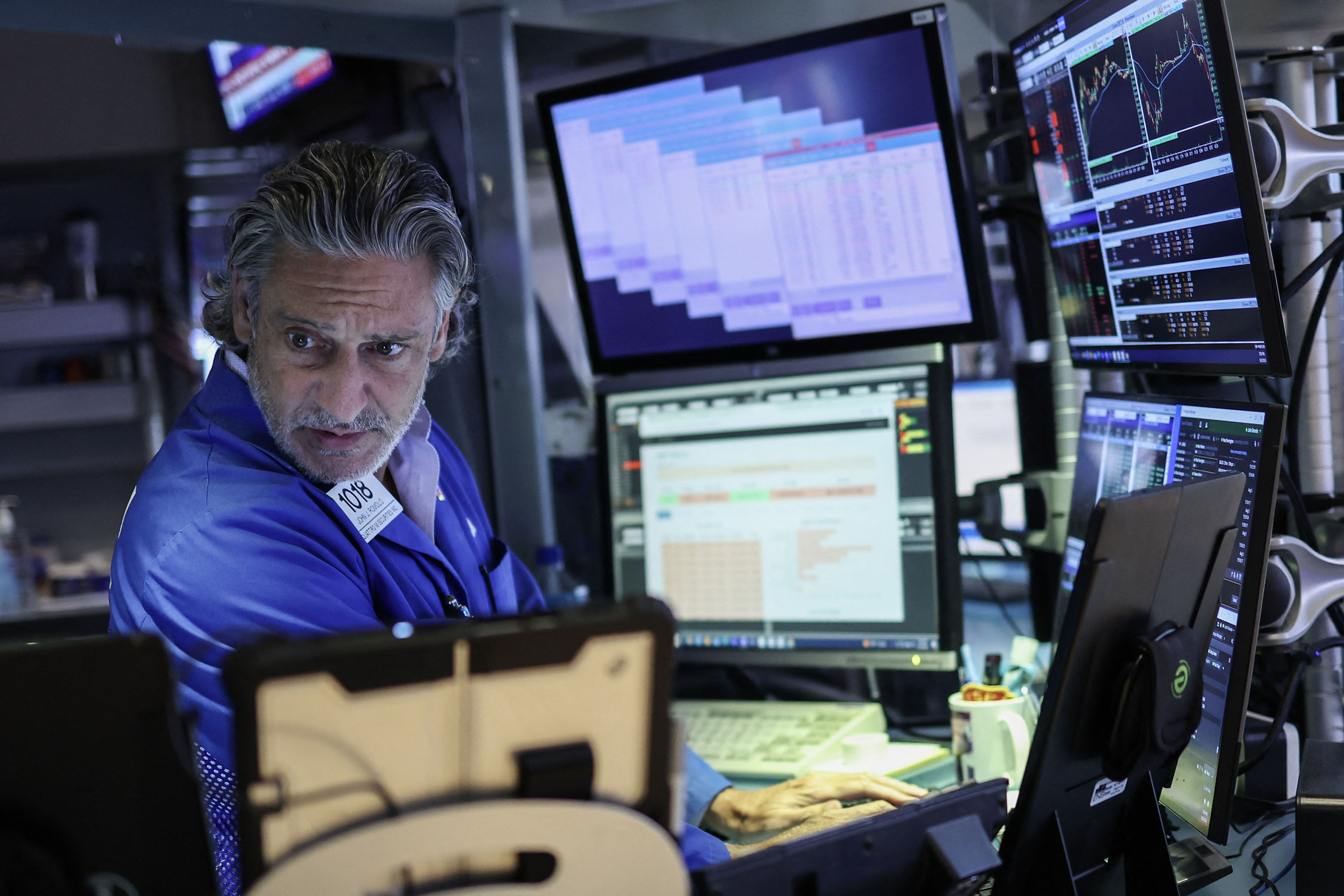A trader works on the floor of the New York Stock Exchange ahead of the closing bell in New York on August 5. Investors have become more sensitive to the risk of a sharper slowdown in the US economy. Photo: AFP