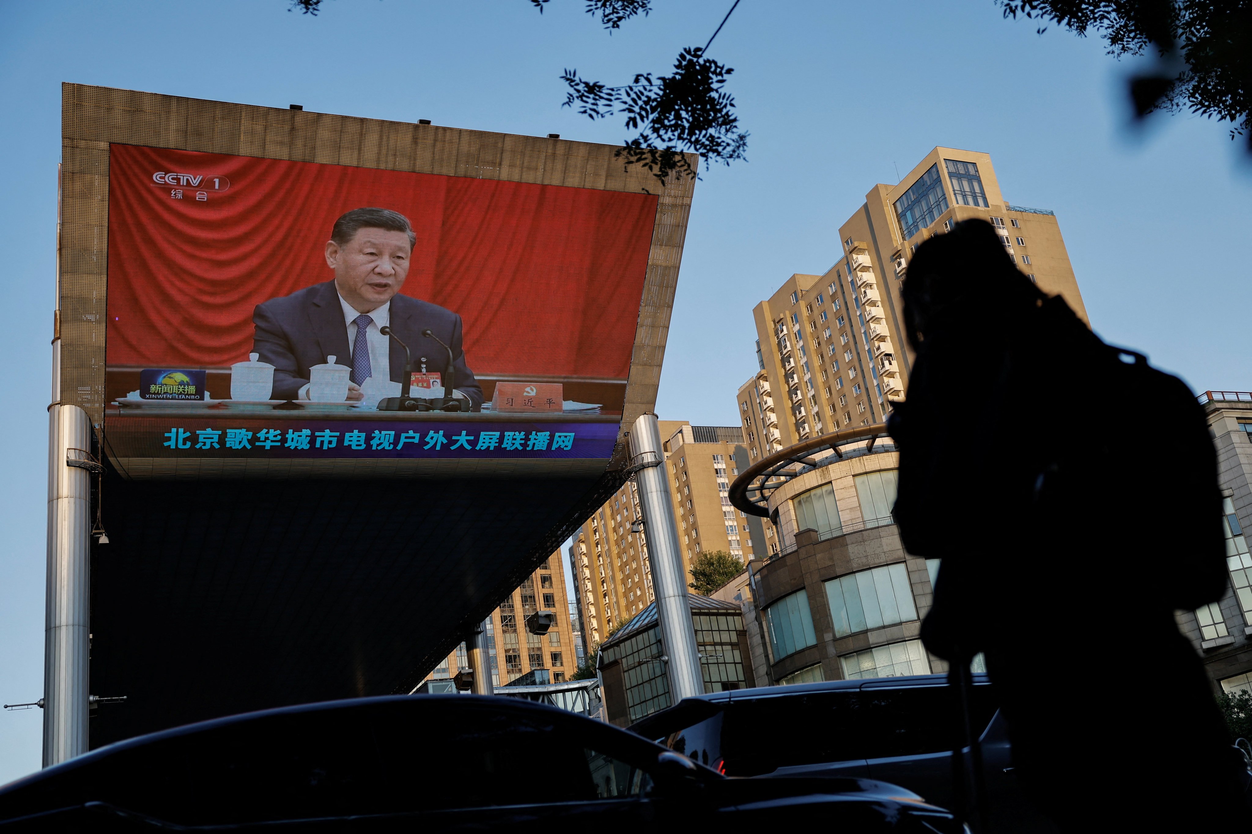 A giant screen shows President Xi Jinping attending the Communist Party’s third plenary session in Beijing on July 18. Photo: Reuters