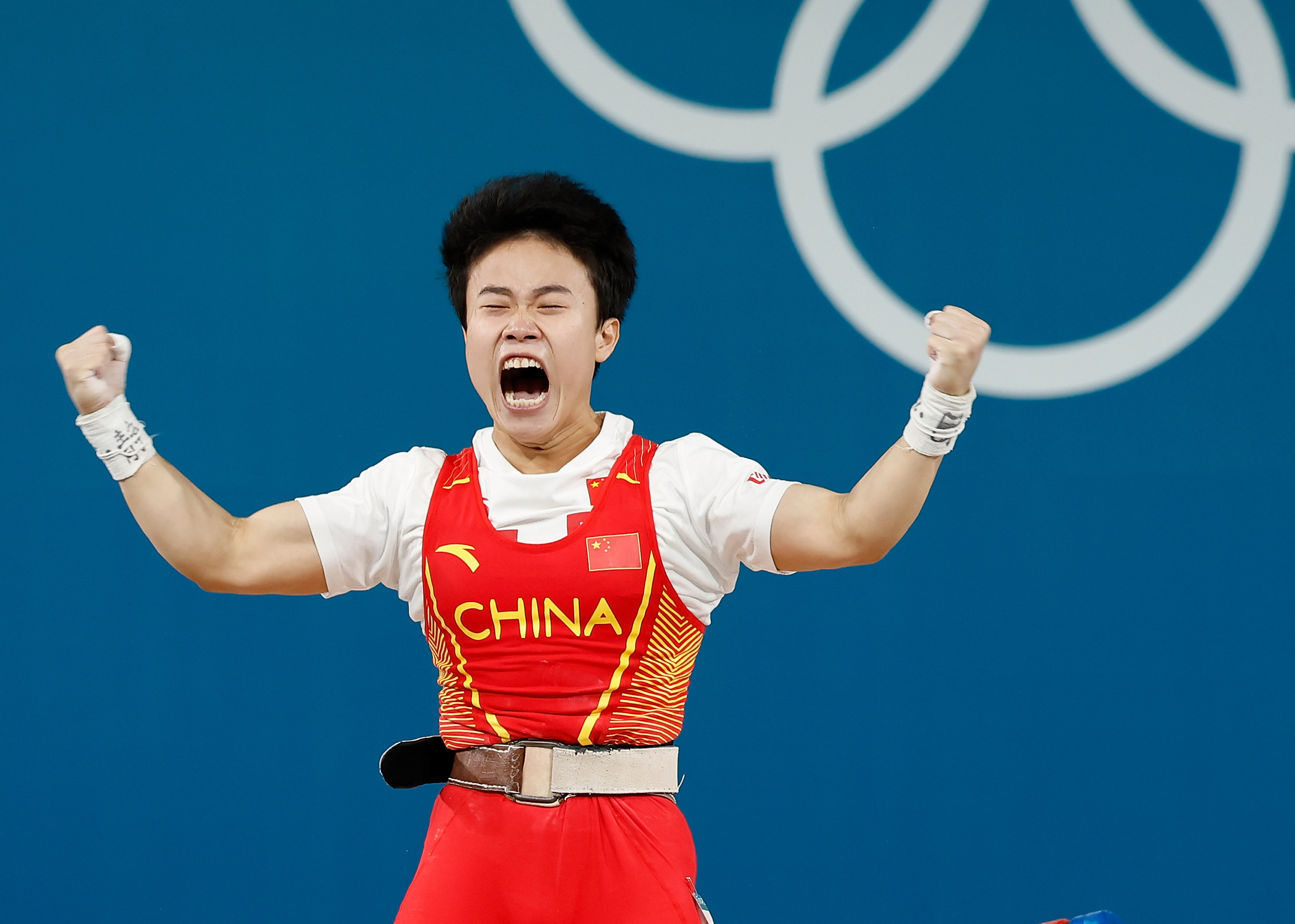 Hou Zhihui celebrates after winning the women’s 49kg weightlifting event. Photo: Xinhua