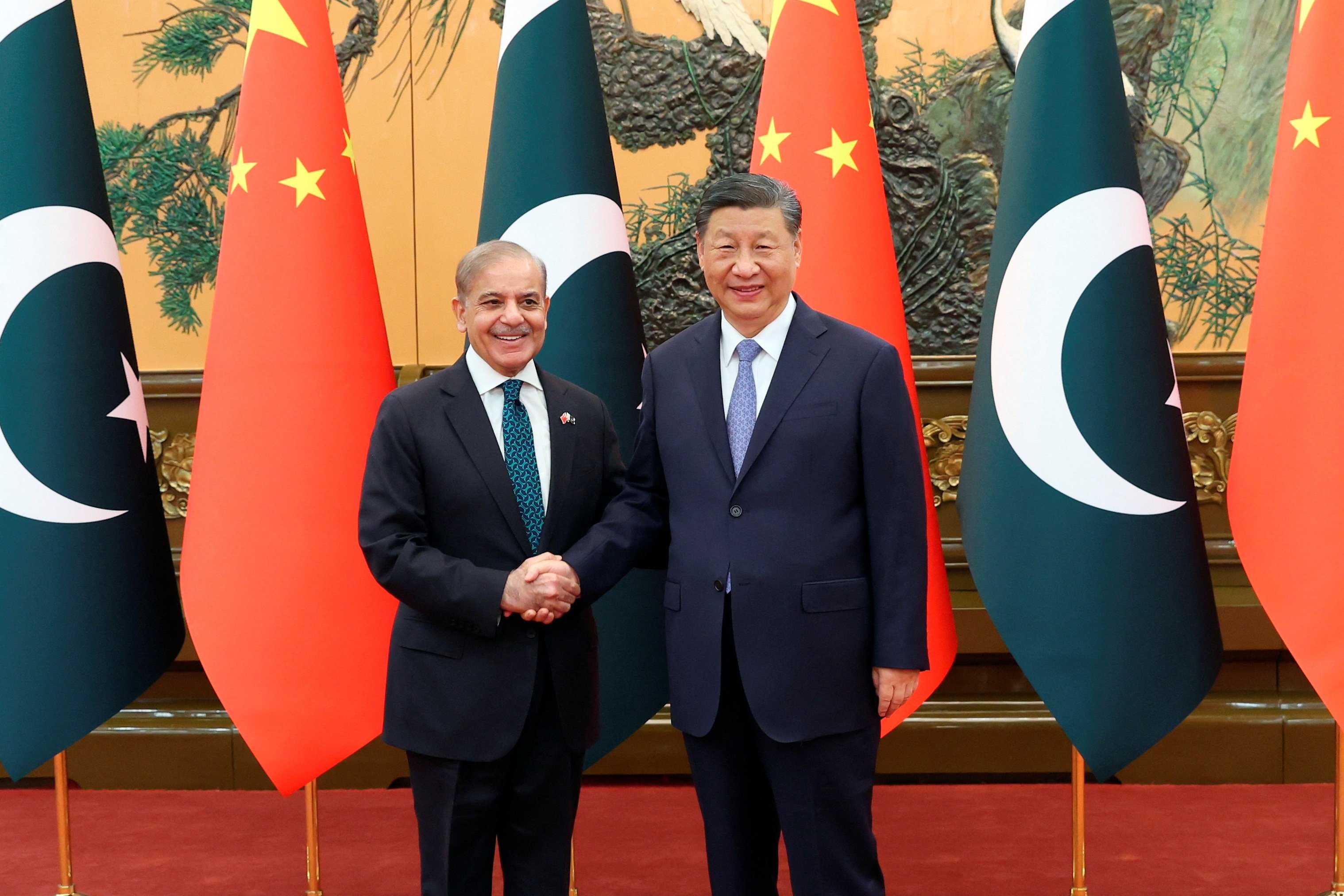 Chinese President Xi Jinping and Pakistani Prime Minister Shehbaz Sharif shake hands at the Great Hall of the People in Beijing on June 7. Photo: China Daily via Reuters