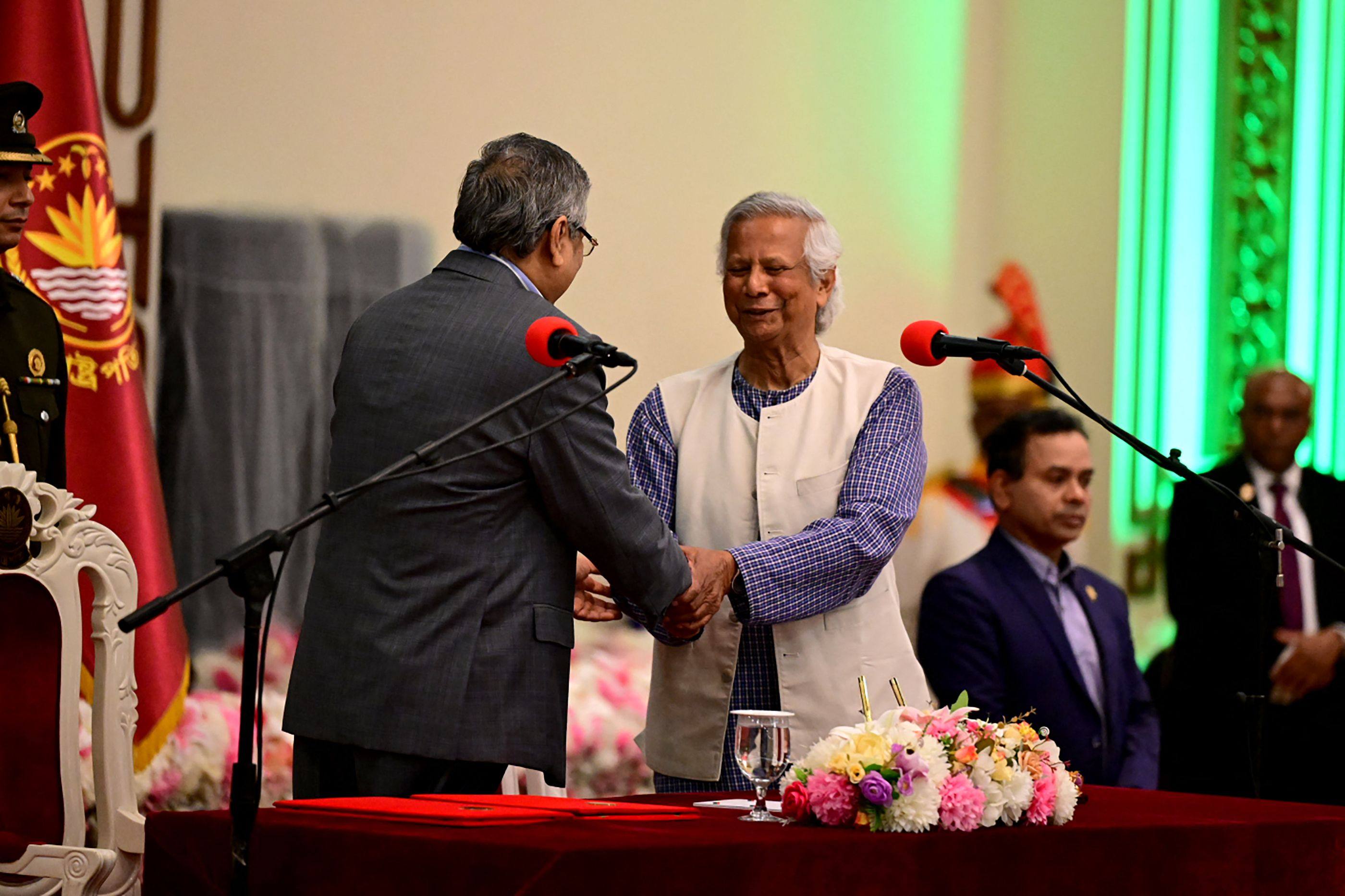 Nobel laureate Muhammad Yunus (middle) is sworn in as the chief adviser of the new interim government of Bangladesh in Dhaka. Photo: AFP