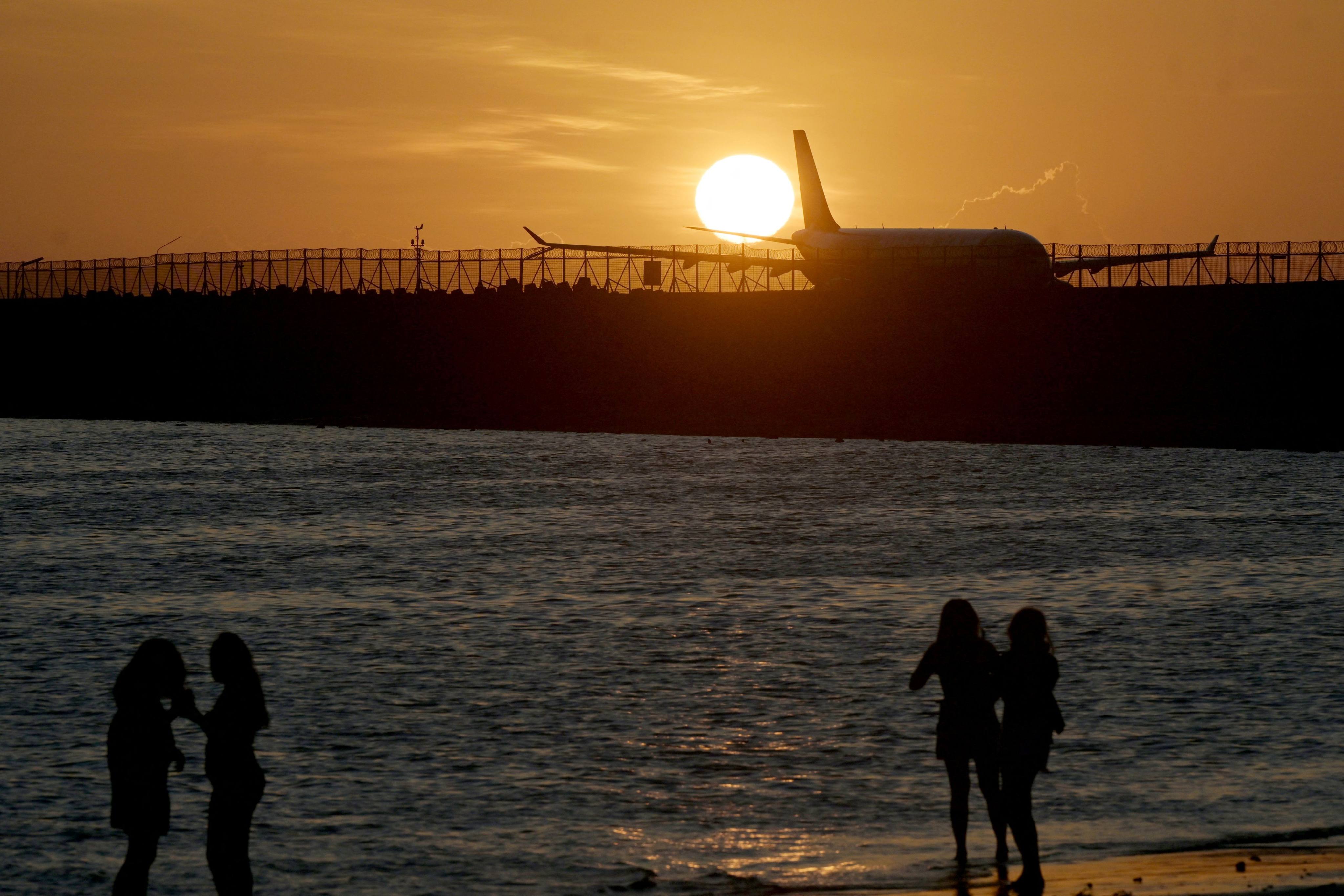 People watch the sunset from a beach in Bali, Indonesia. A business group said building a casino on the island would boost the tourist hub’s income by up to US$809 million. Photo: AFP