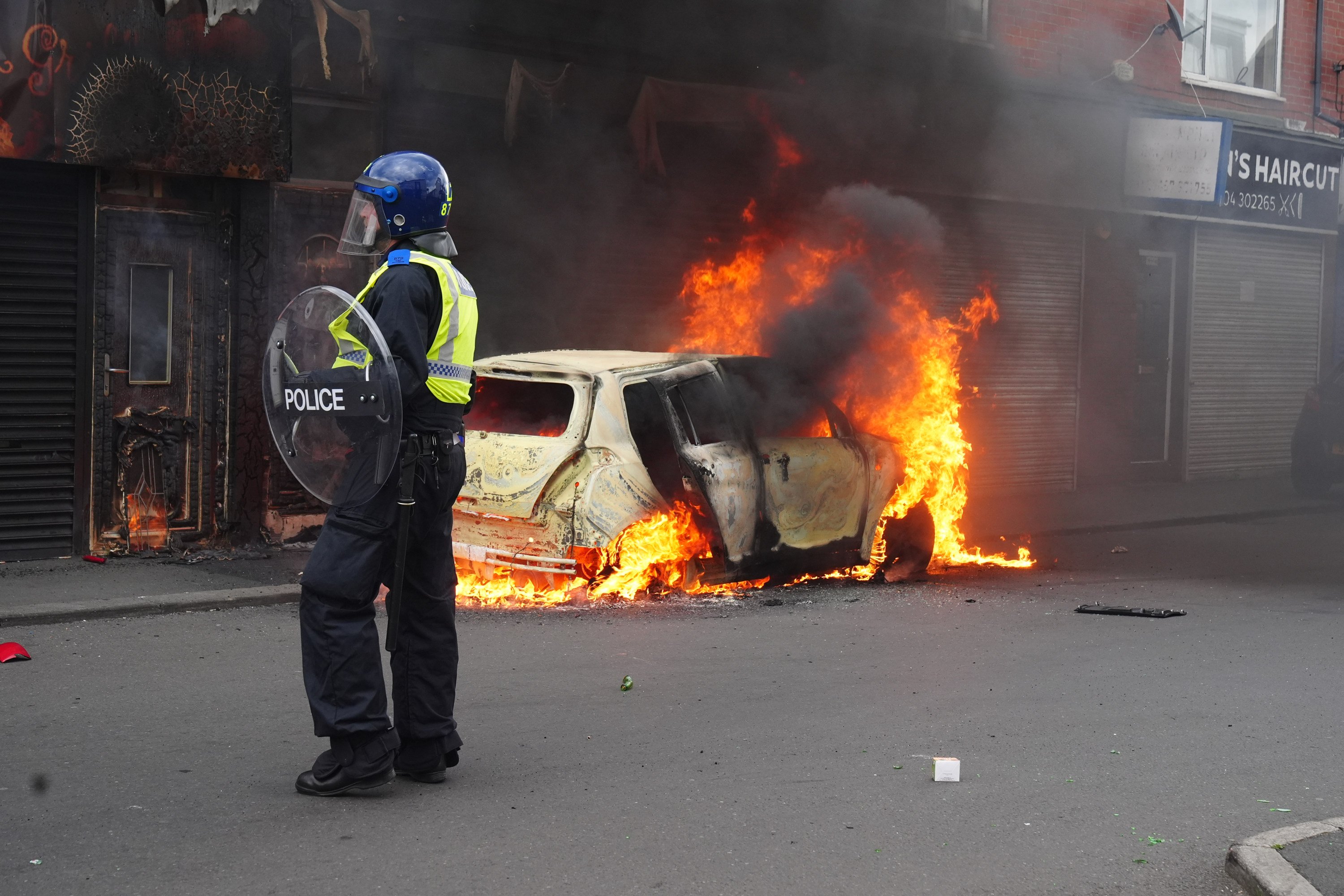 A car burns on Parliament Road in Middlesbrough during a demonstration tied to the popularity of Europe’s far right and social and economic problems perceived to be caused by immigration. Photo: dpa