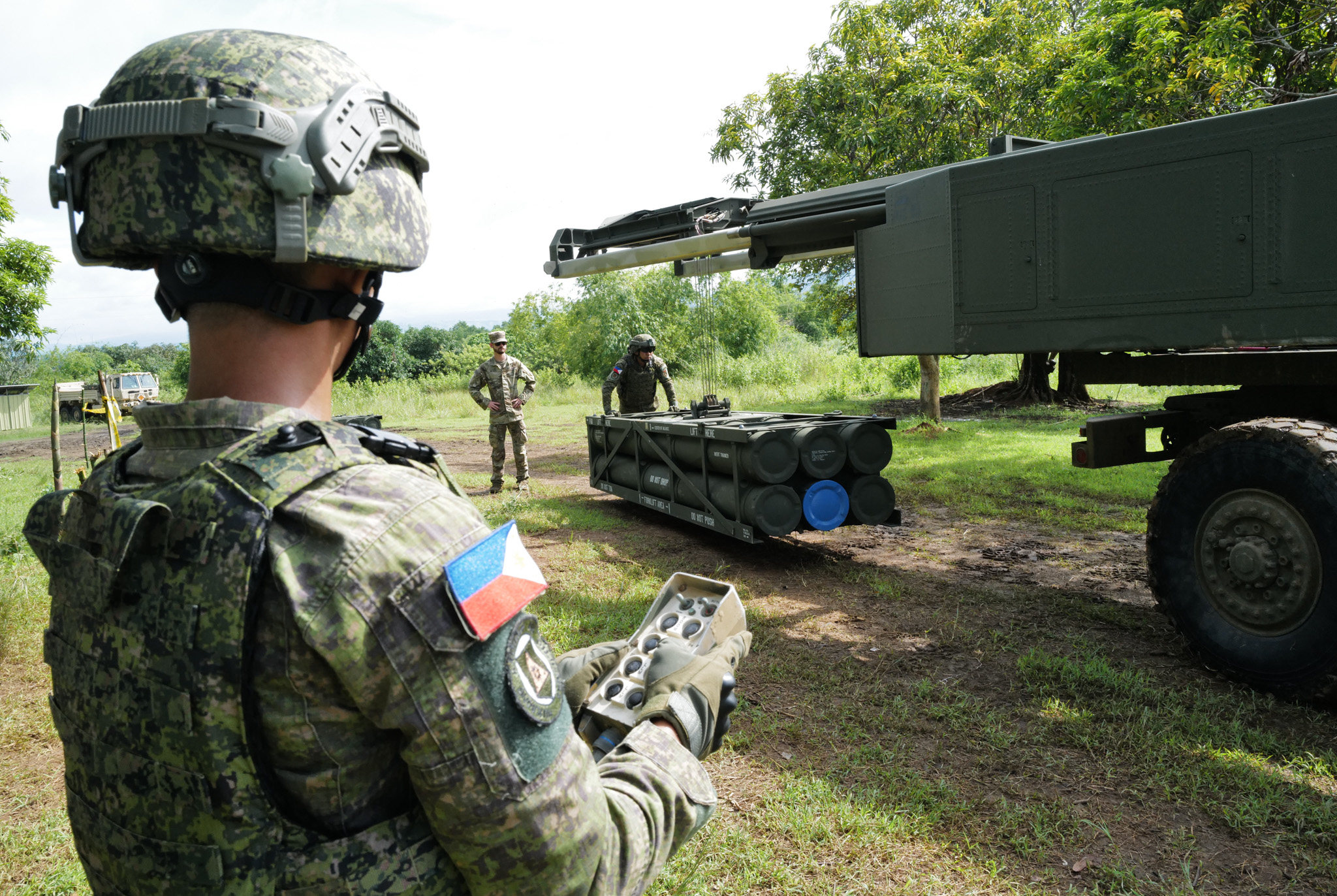 Filipino soldiers prepare the HIMARs by loading the rockets before the live fire drill. Photo: Jeoffrey Maitem