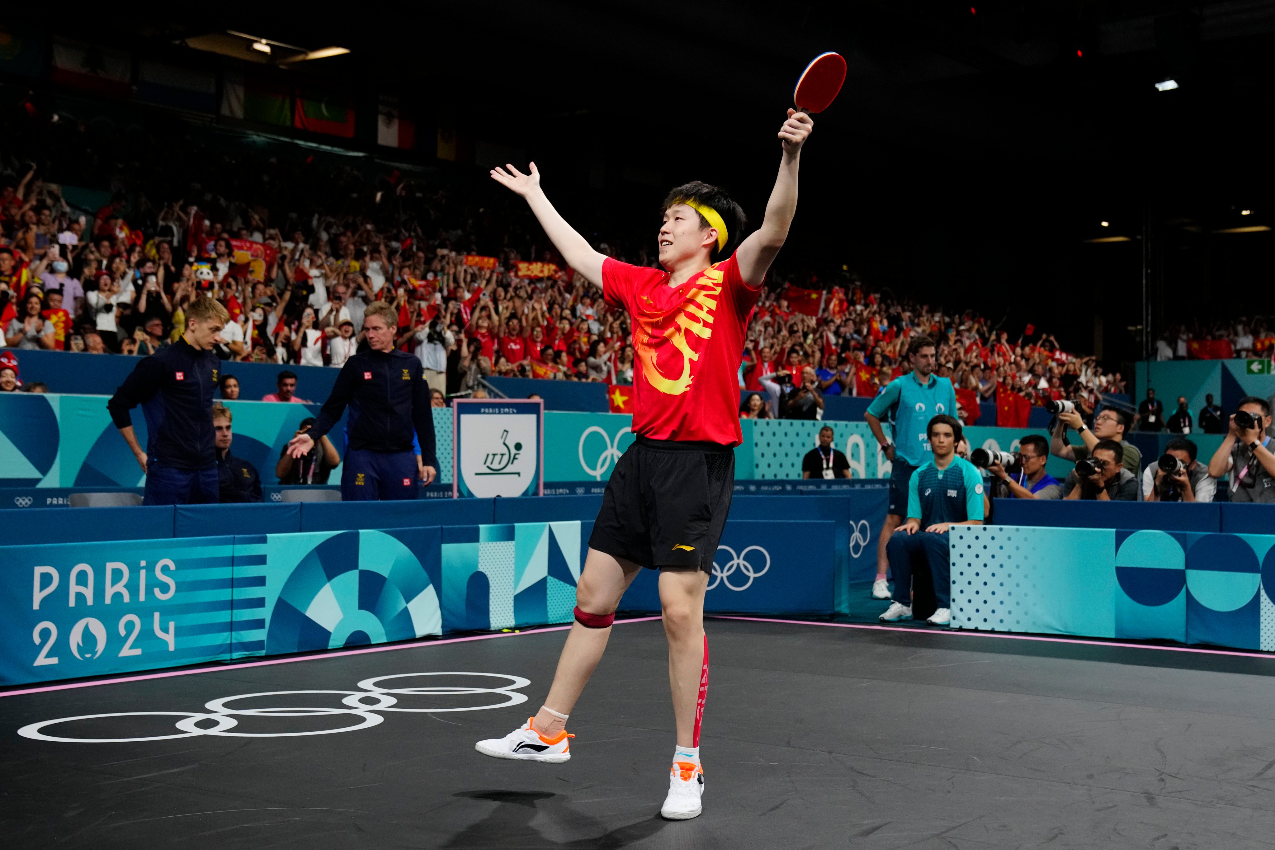 China’s Wang Chuqin celebrates after beating Sweden’s Kristian Karlsson in the men’s gold medal team table tennis match. Photo: AP