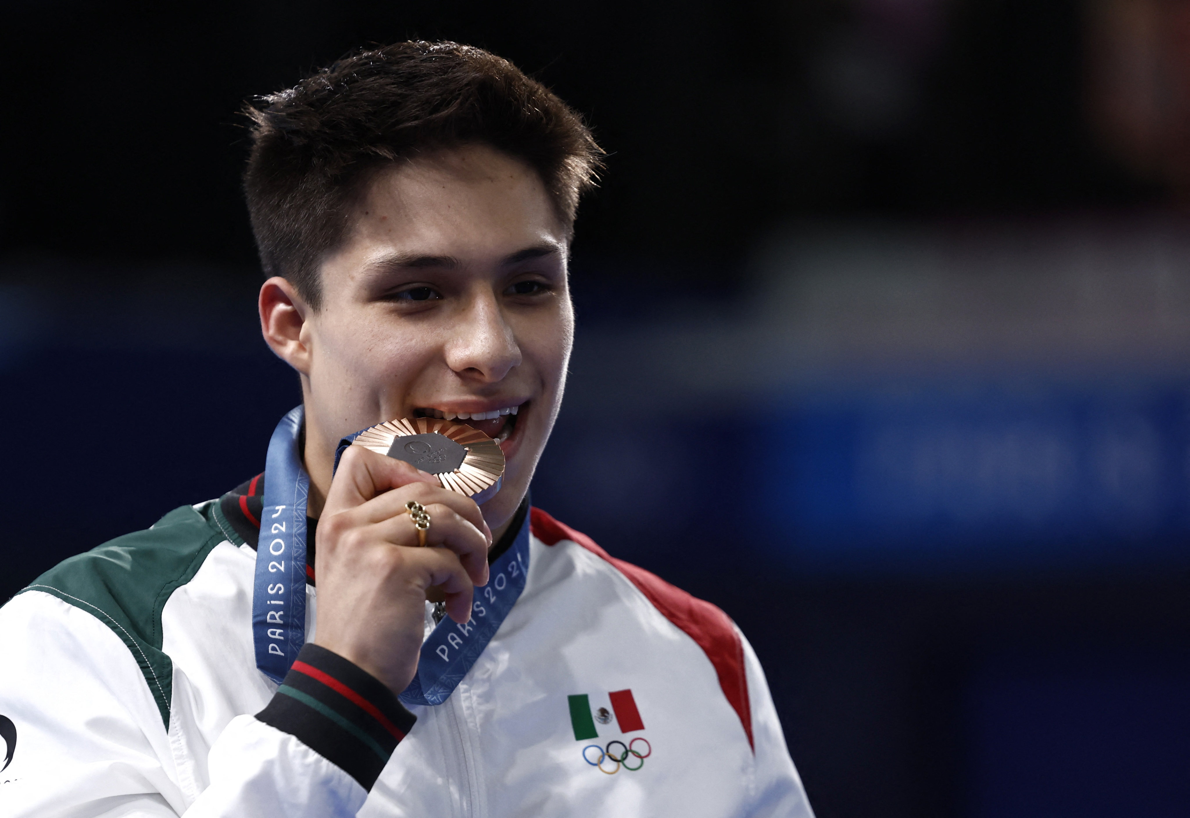 Osmar Olvera celebrates winning bronze in the men’s 3m springboard. Photo: Reuters