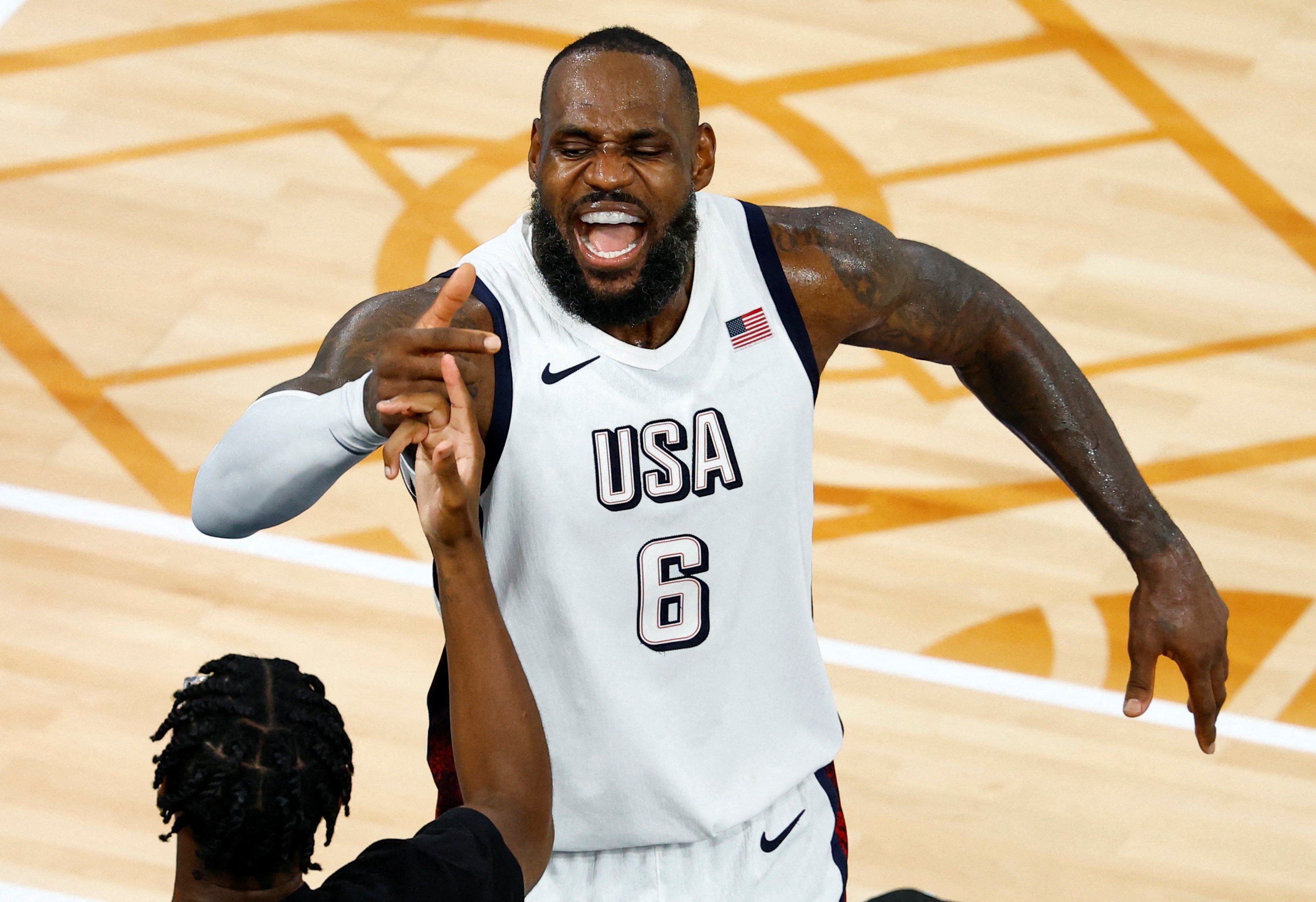 LeBron James and his United States teammates can almost taste their men’s basketball gold... but first need to overcome hosts France. Photo: Reuters