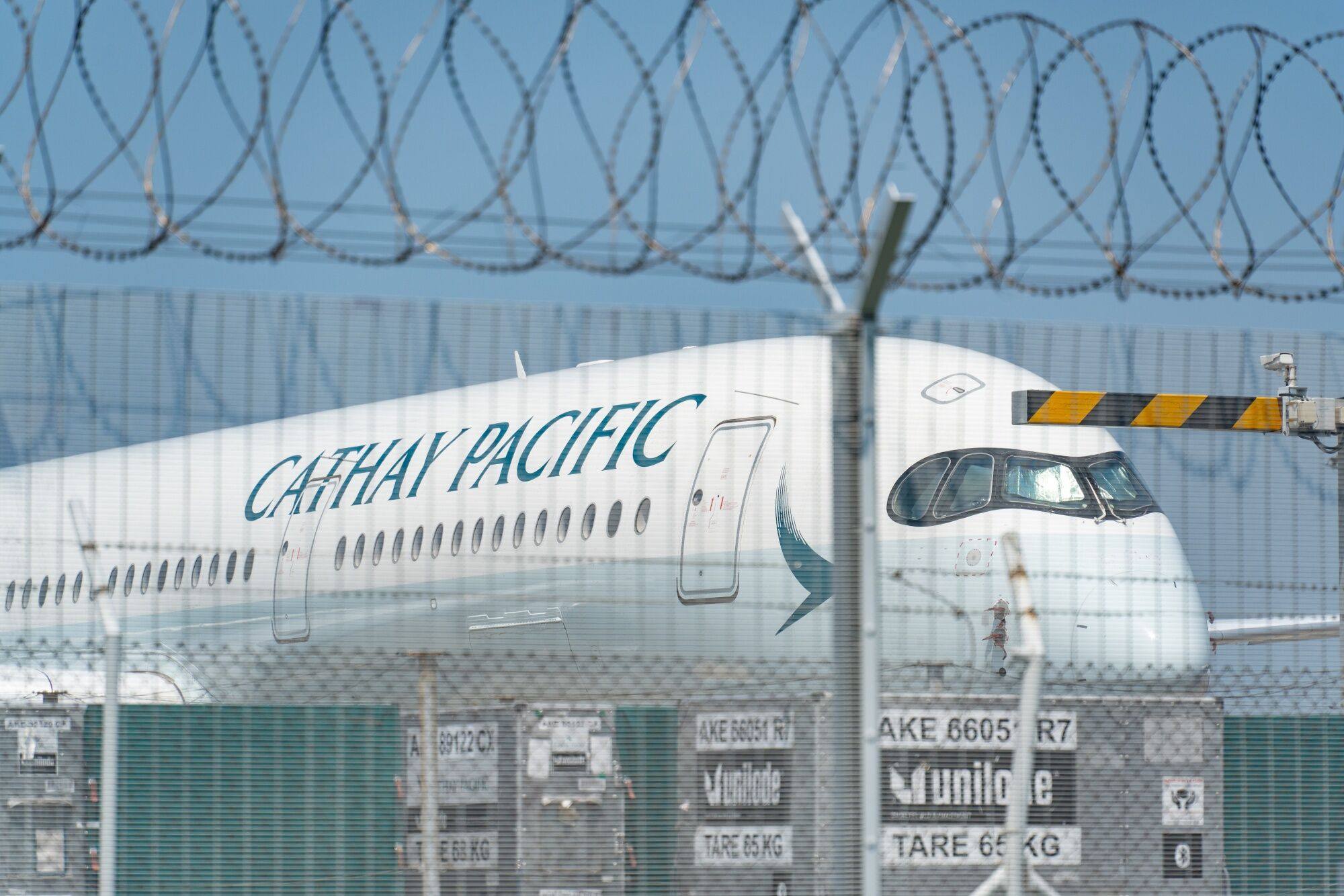 A Cathay aircraft sits at Hong Kong International Airport on August 7. The airline has announced plans to invest more than HK$100 billion by adding more aircraft to its fleet along with other upgrades. Photo: Bloomberg