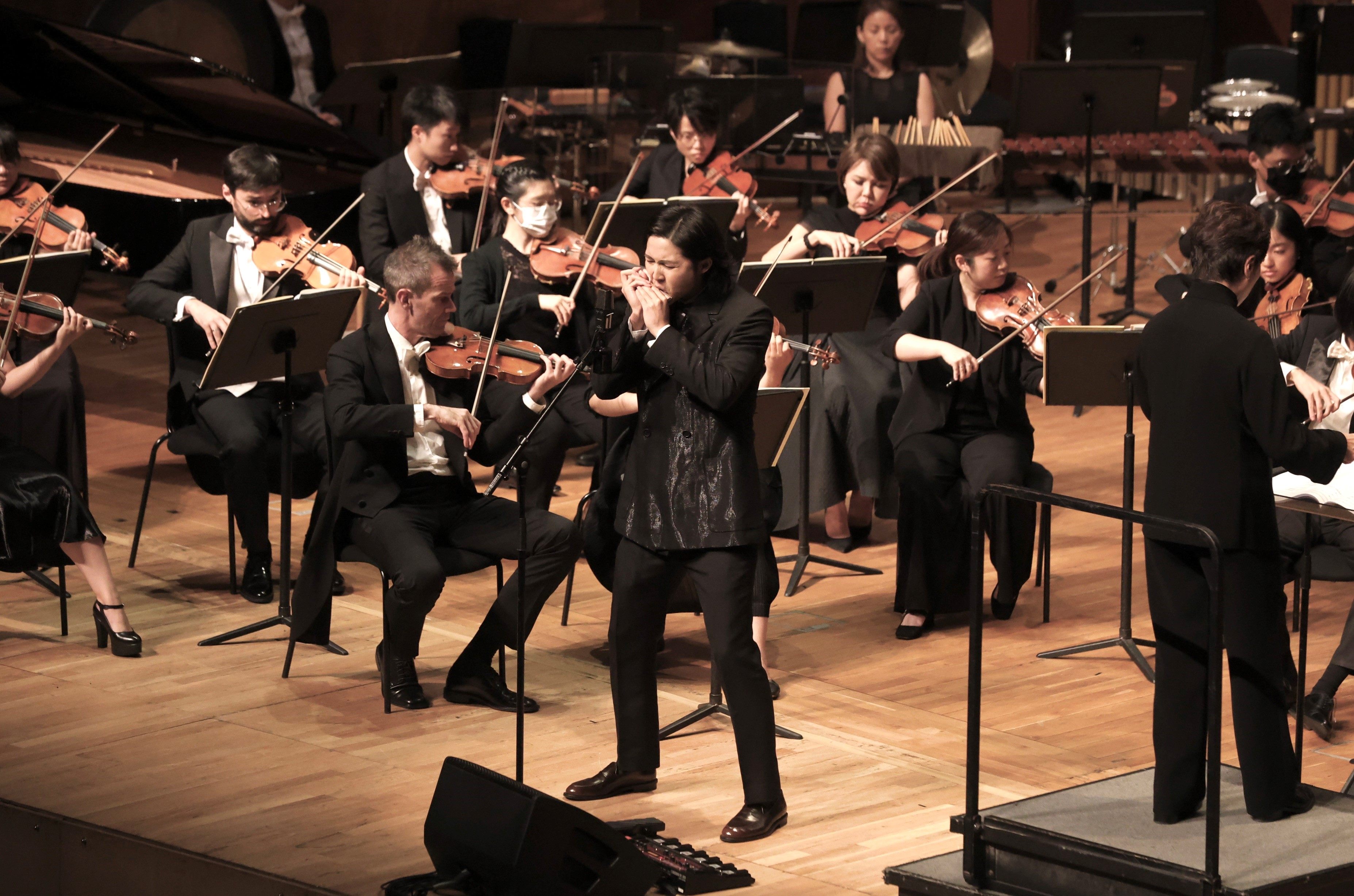 Harmonica player Cy Leo performs with the Hong Kong Sinfonietta on August 10, 2024, at the Hong Kong City Hall Concert Hall. Photo: HK Sinfonietta Ltd