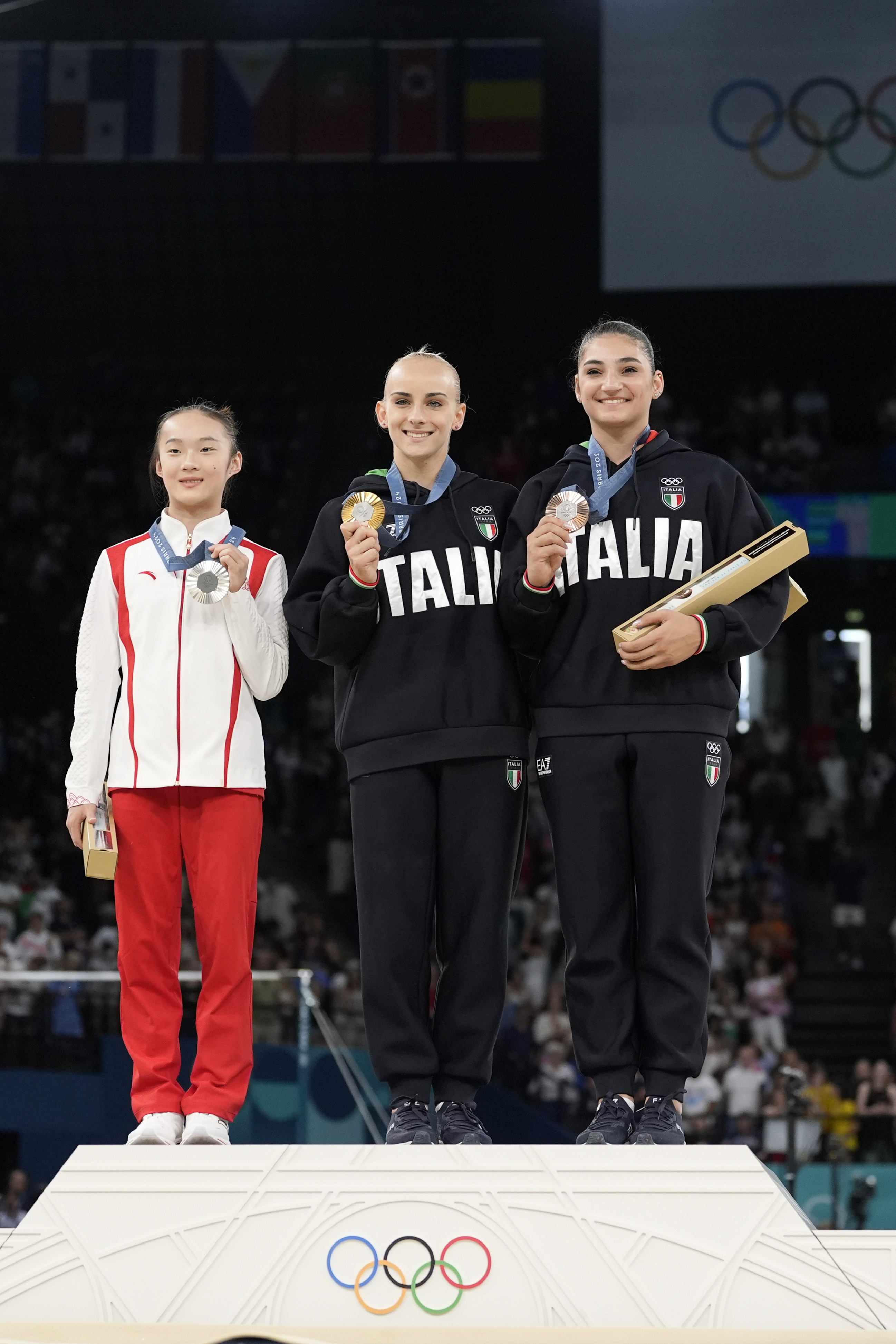 Zhou Yaqin (left) on the podium for the individual women’s artistic gymnastics provided a heartwarming Paris Olympics moment. Photo: AP