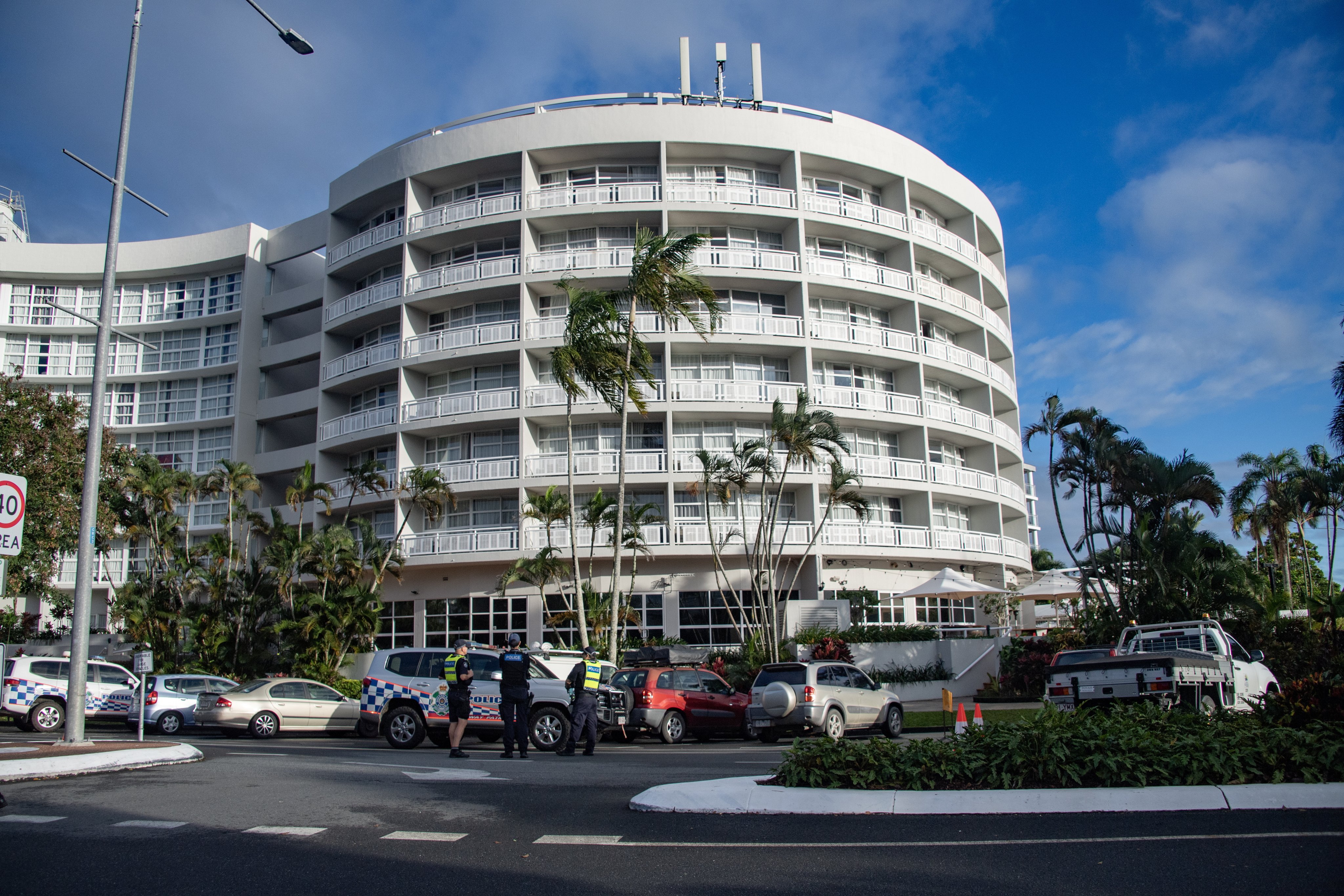 Emergency service workers at the DoubleTree by Hilton hotel in Cairns after a helicopter crashed into its roof on Monday. Photo: EPA-EFE