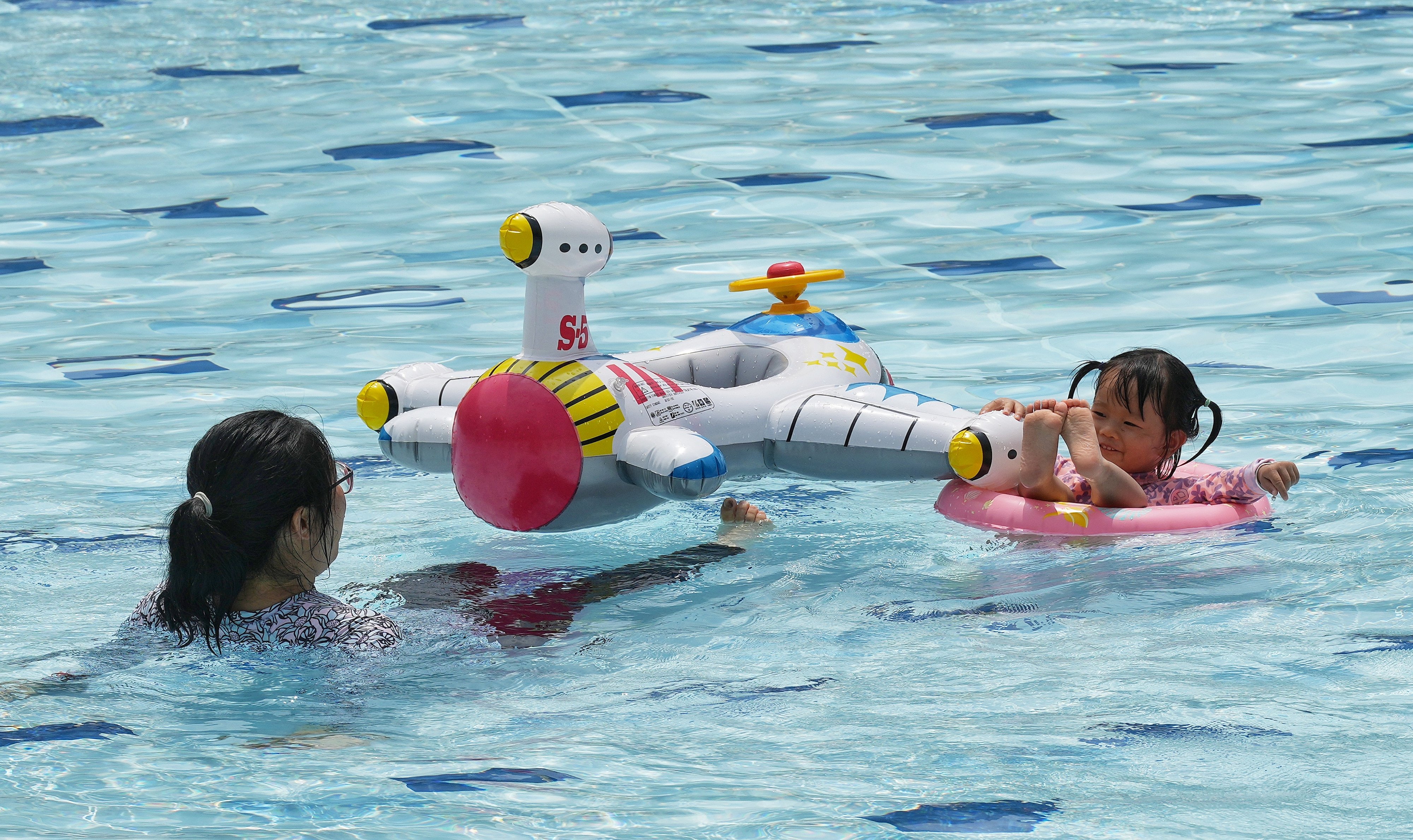 A child floats at Hammer Hill Road Swimming Pool on May 30. Swimming proficiency should be improved among young people in Hong Kong, both to equip the community with an important skill and to develop future Olympic champions. Photo: Elson Li