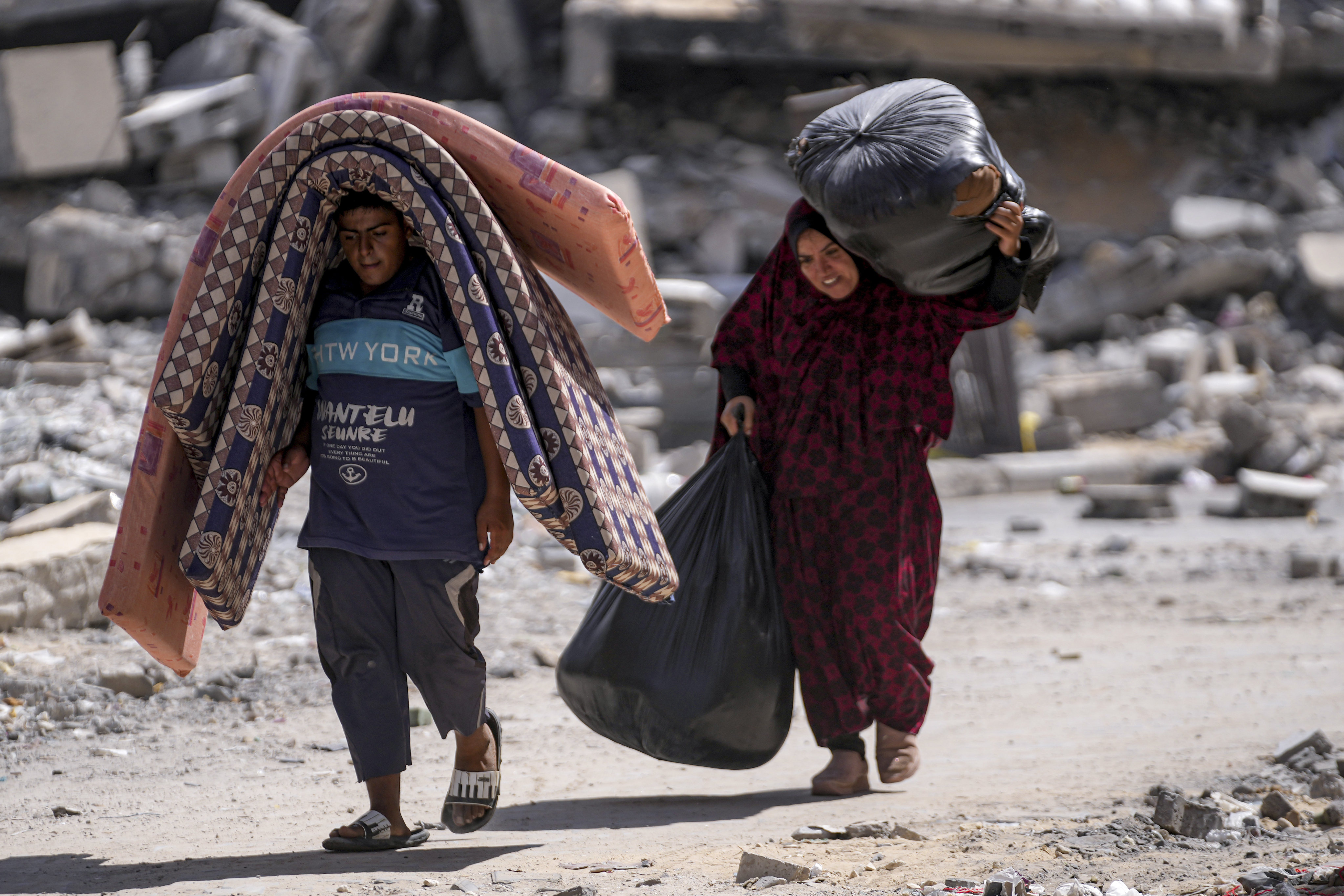 Palestinians leave the Hamad City neighbourhood of Khan Younis, Gaza following an evacuation order by the Israeli army on Sunday. Photo: AP