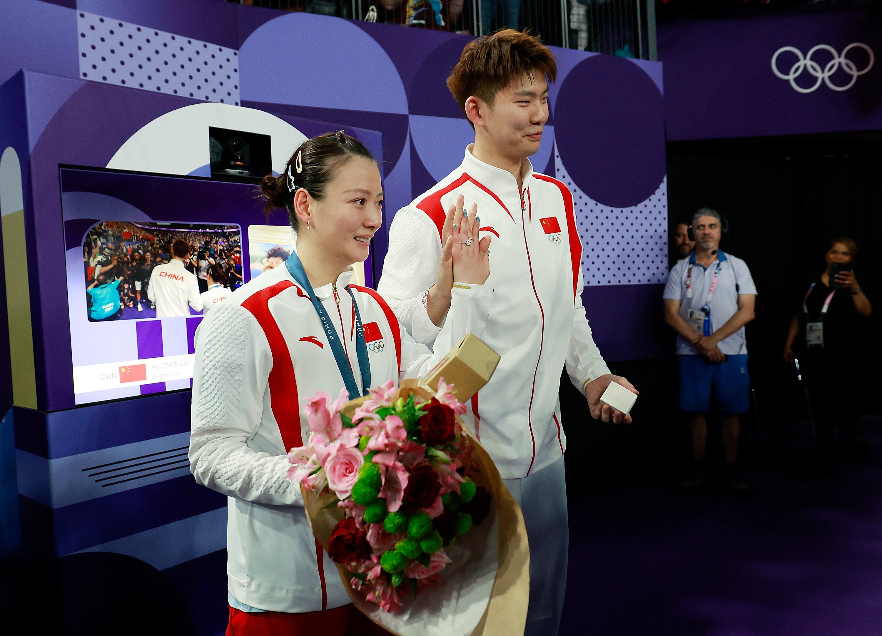 Liu Yuchen (right) and fiancee, gold medallist Huang Yaqiong, are all smiles after getting engaged in Paris. Photo: Xinhua