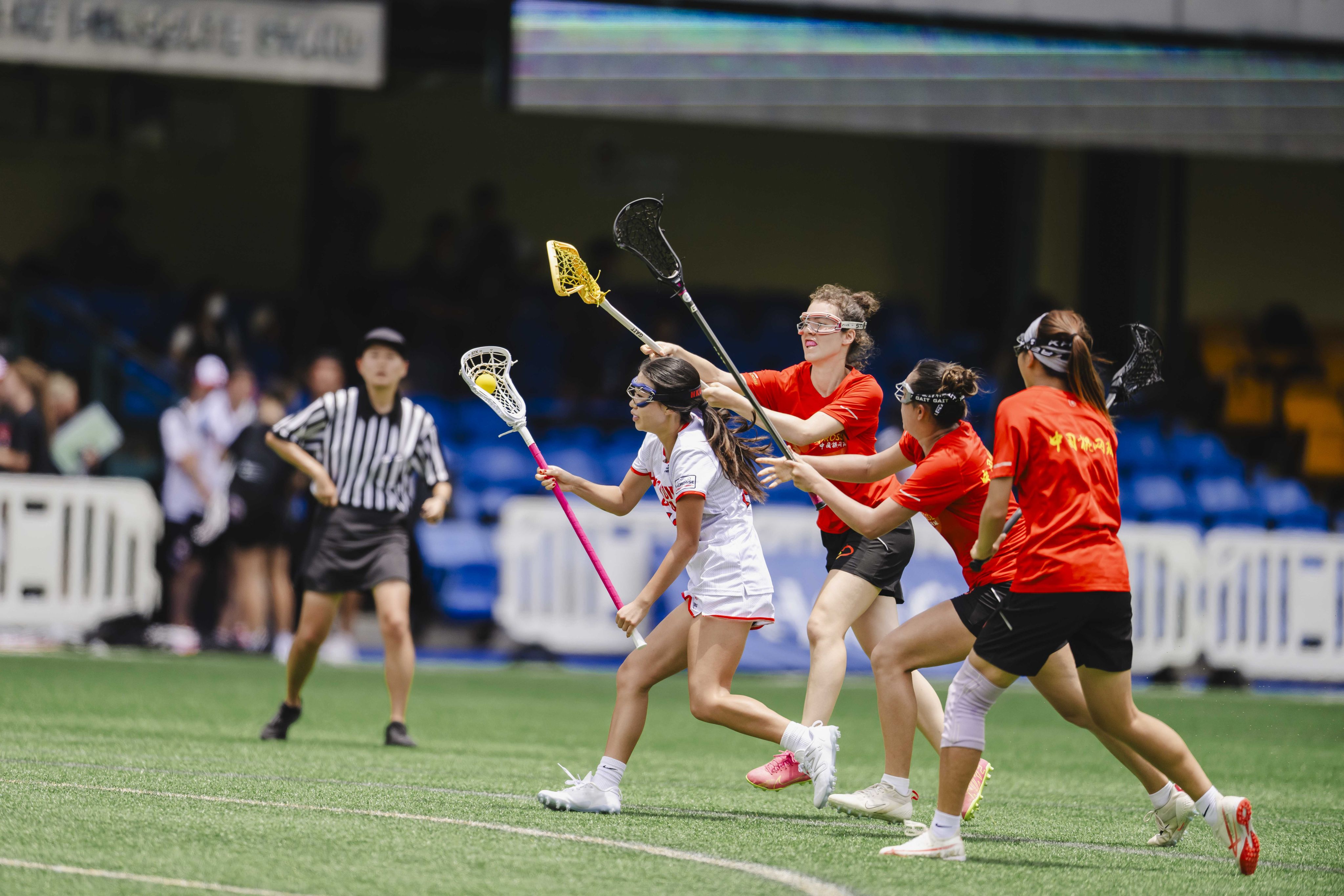 China and Hong Kong (in white) played out a friendly match at the Hong Kong Football Club on Tuesday. Photo: Hong Kong, China Lacrosse Association