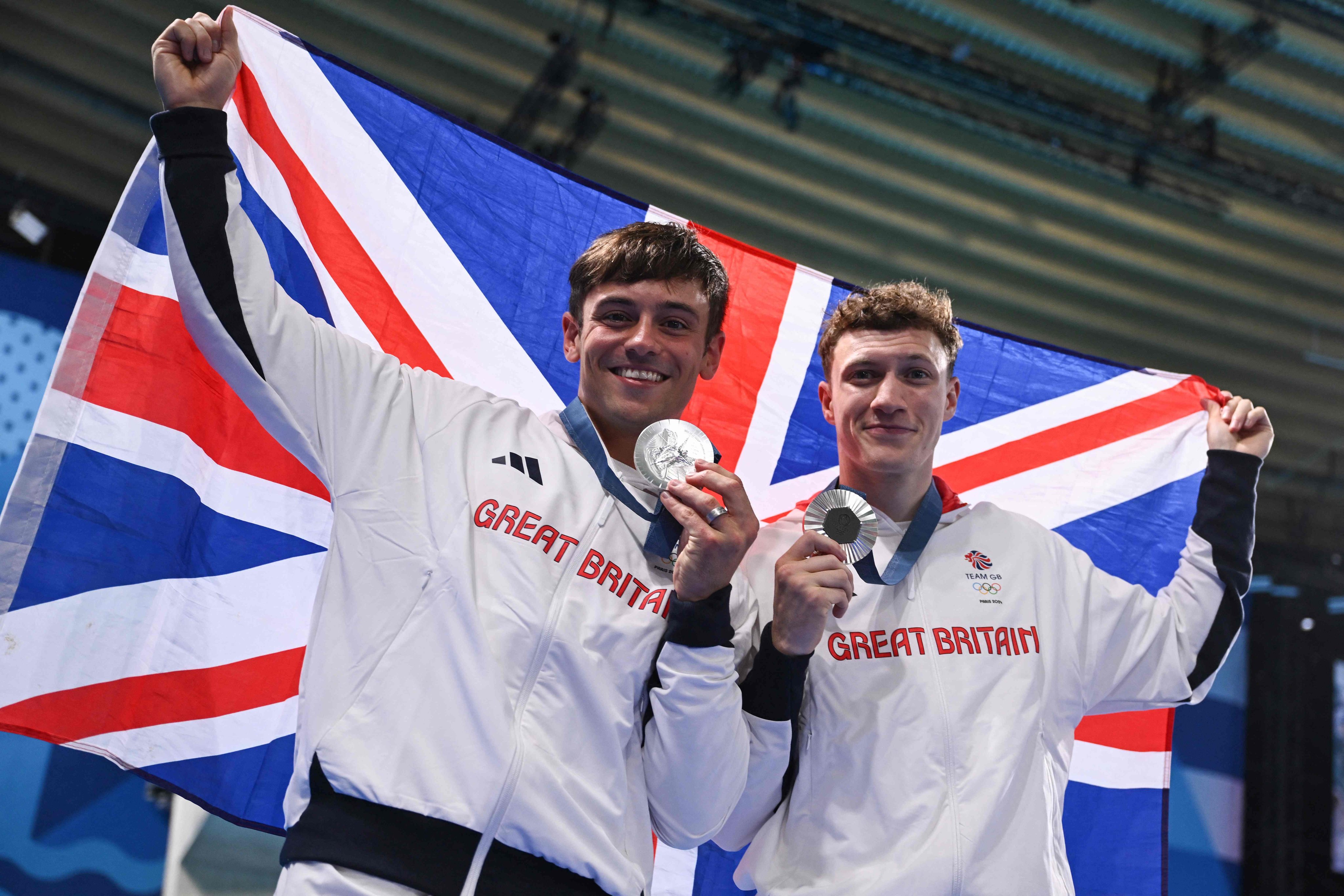 Silver medallists Noah Williams (right) and Tom Daley celebrate with their medals after the men’s synchronised 10m platform at the Paris 2024 Olympic Games. Photo: AFP