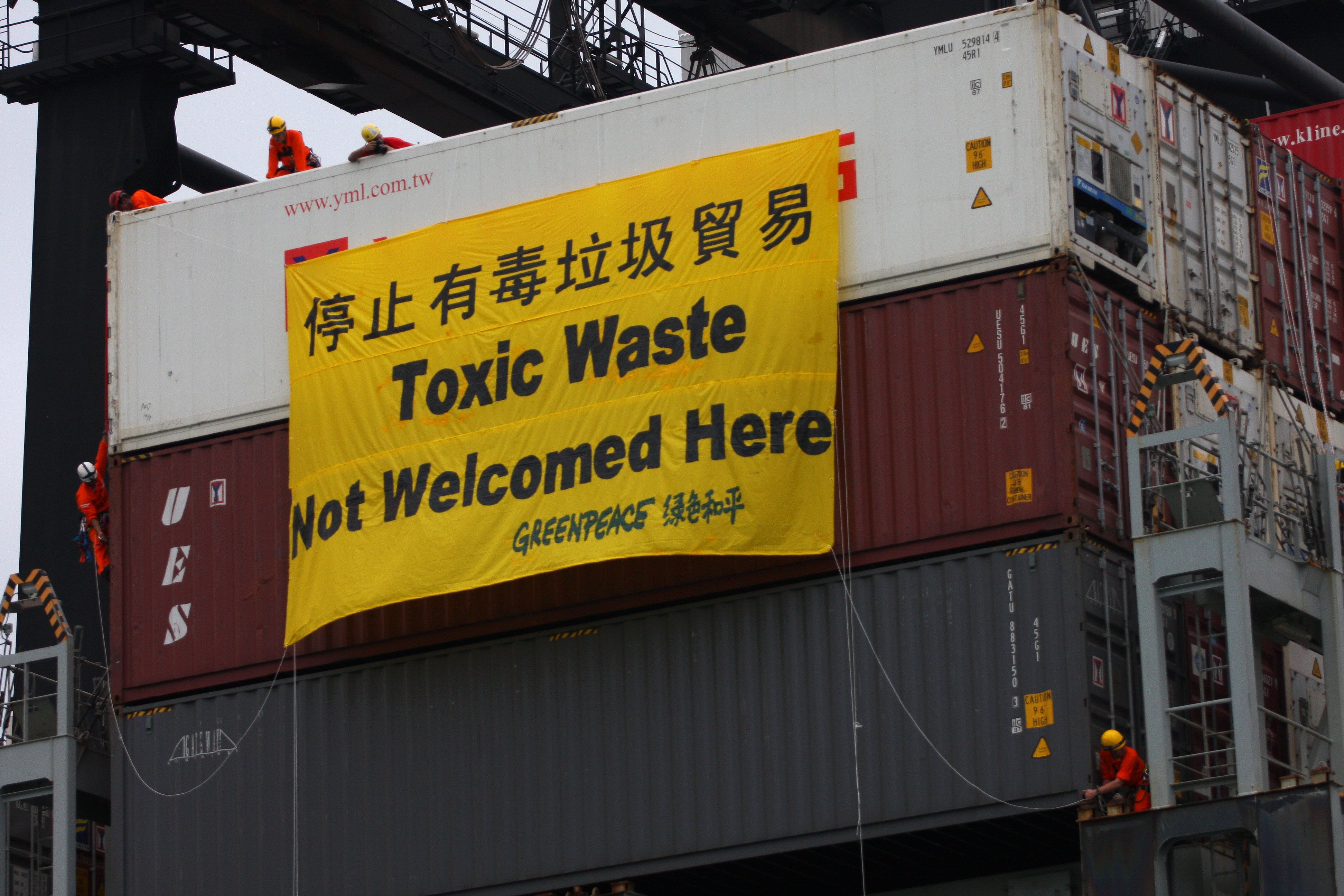 Greenpeace activists prevented the offloading of a container of waste electronic devices from the US, on its way to China, via Hong Kong in June 2018. Thai authorities are racing to stop about 100 shipping containers allegedly filled with hazardous industrial waste from reaching the nation’s ports. Photo: SCMP