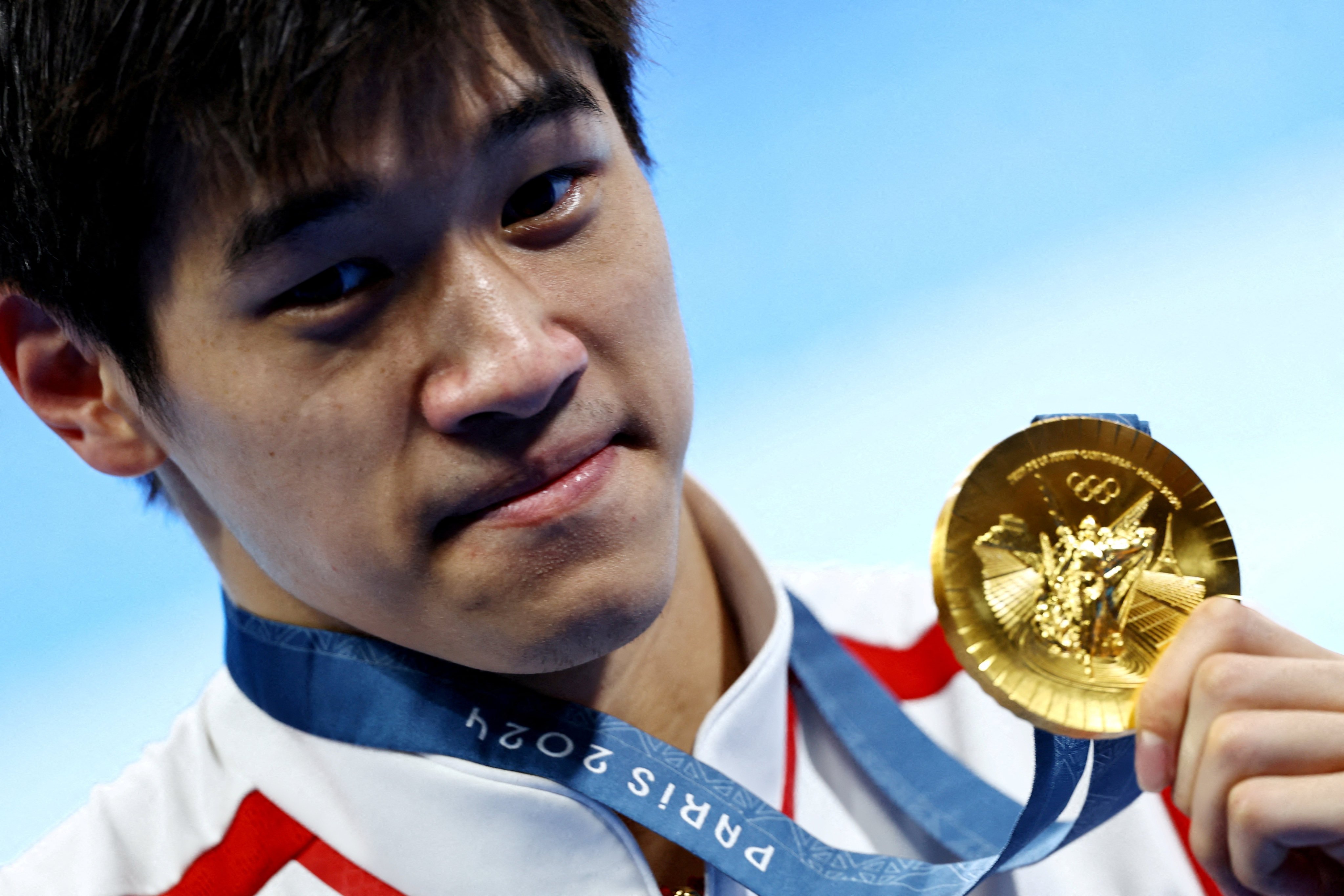 Chinese gold medallist Pan Zhanle celebrates winning the men’s 100m in a world record time. Photo: Reuters