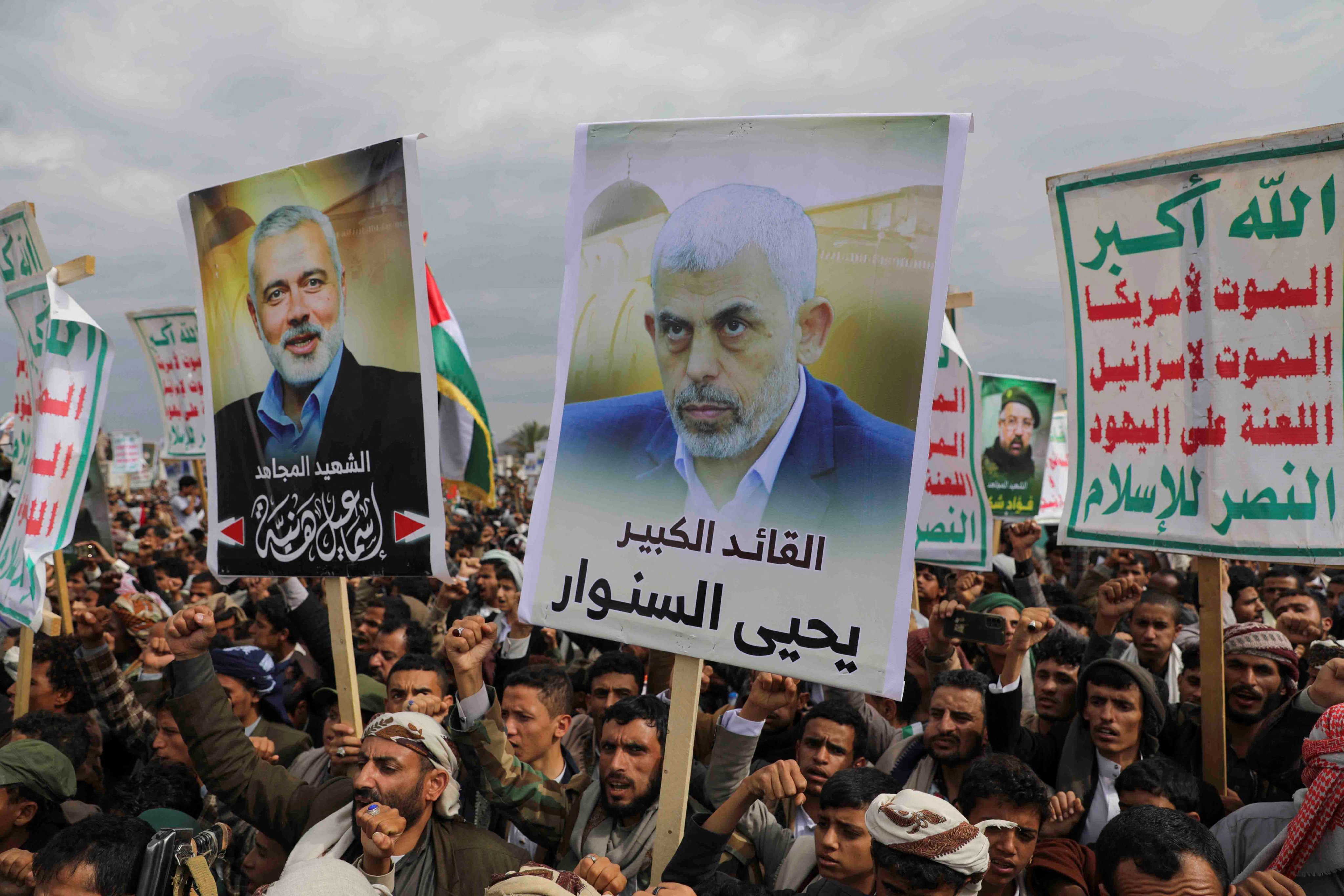 Protesters hold up posters of newly appointed Hamas leader Yahya Sinwar and assassinated Hamas chief Ismail Haniyeh at a rally in Sanaa, Yemen. Photo: Reuters