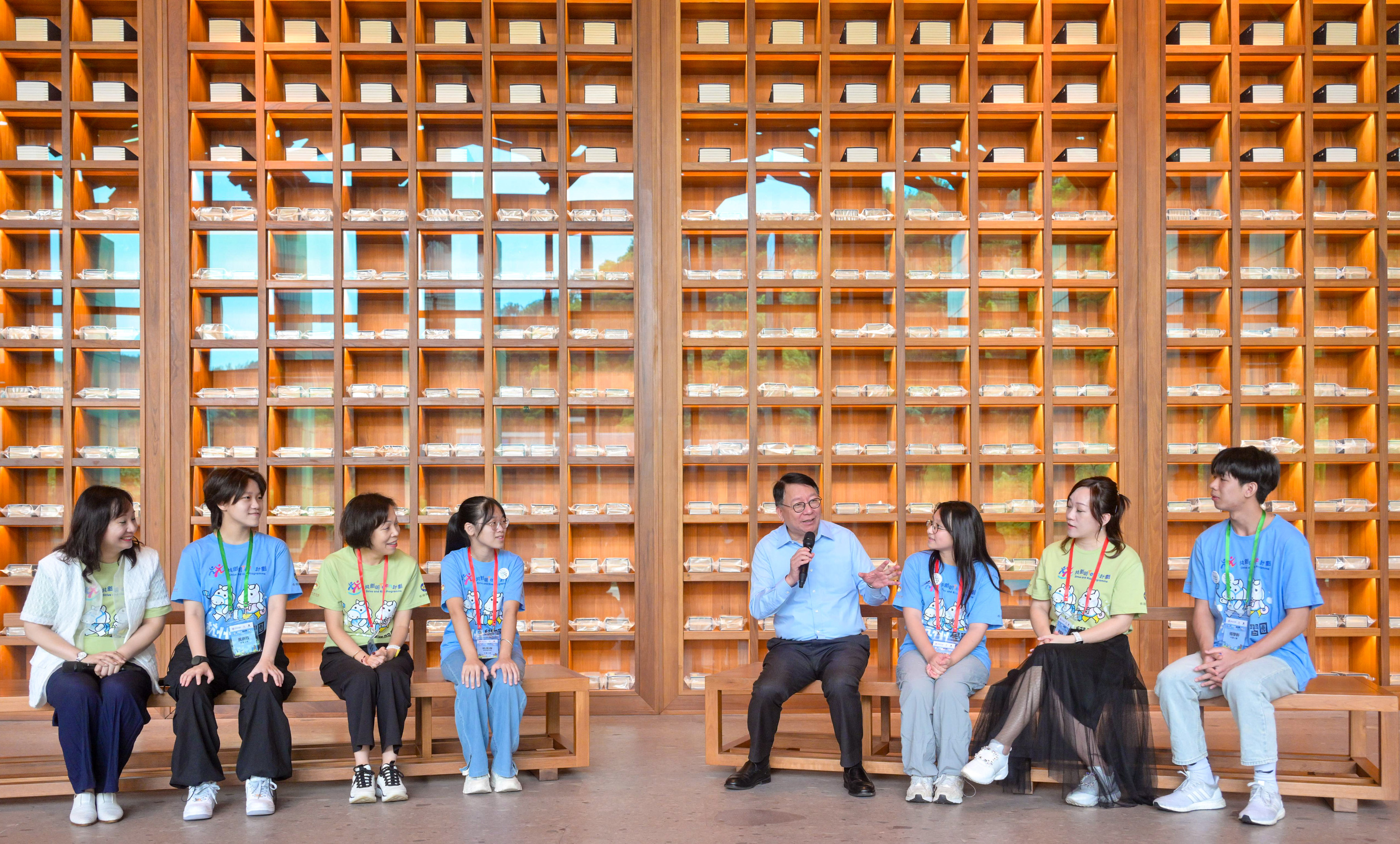 Chief Secretary Eric Chan (fourth from right) speaks to attendees of a talent mentorship programme at the Hangzhou National Archives of Publications and Culture. Photo: Handout