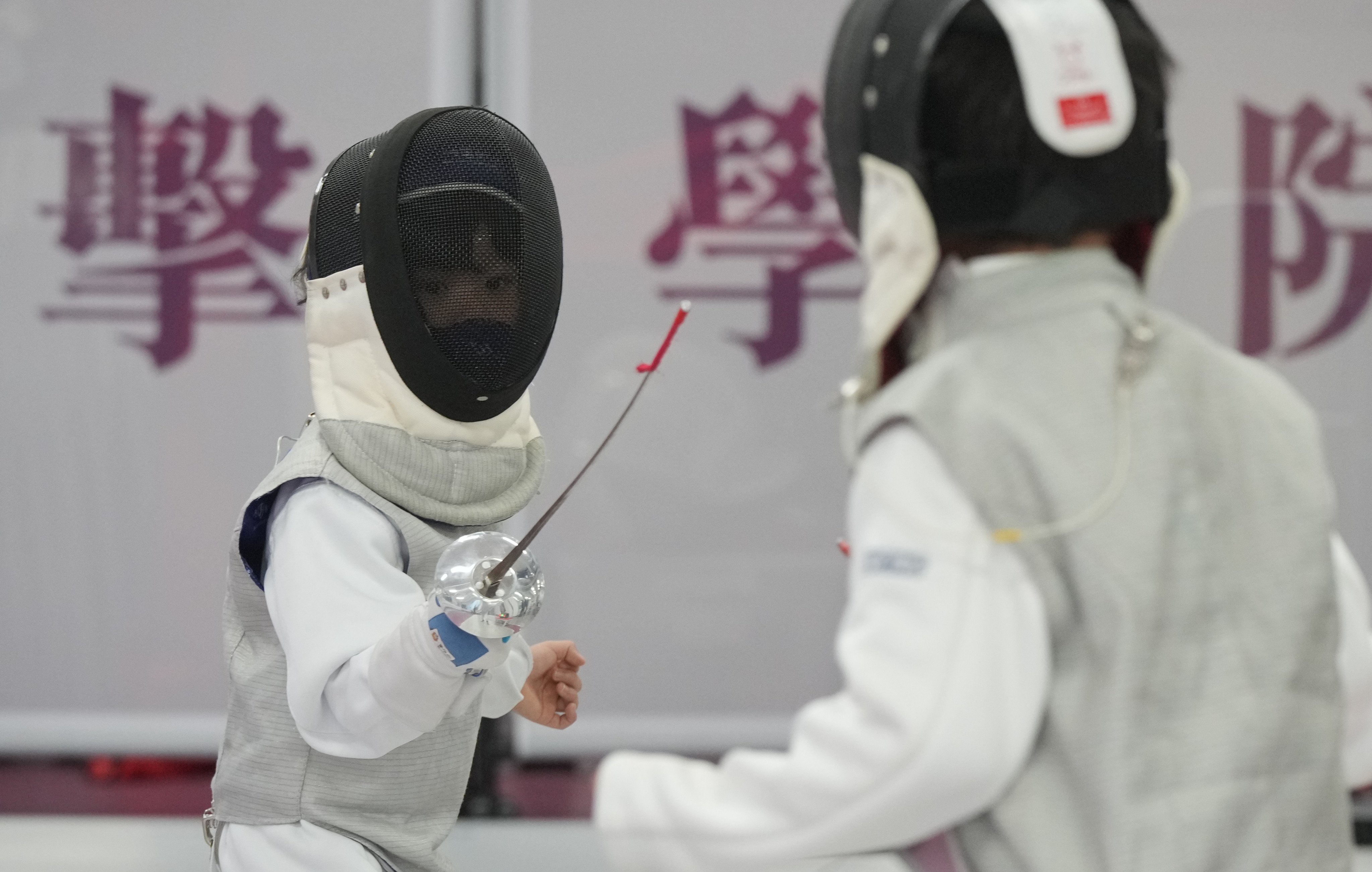 Boys practice at a fencing school in Jordan, Hong Kong, on August 1. The success of Hong Kong fencers at the Olympics has boosted interest in the sport in the city. Photo: May Tse