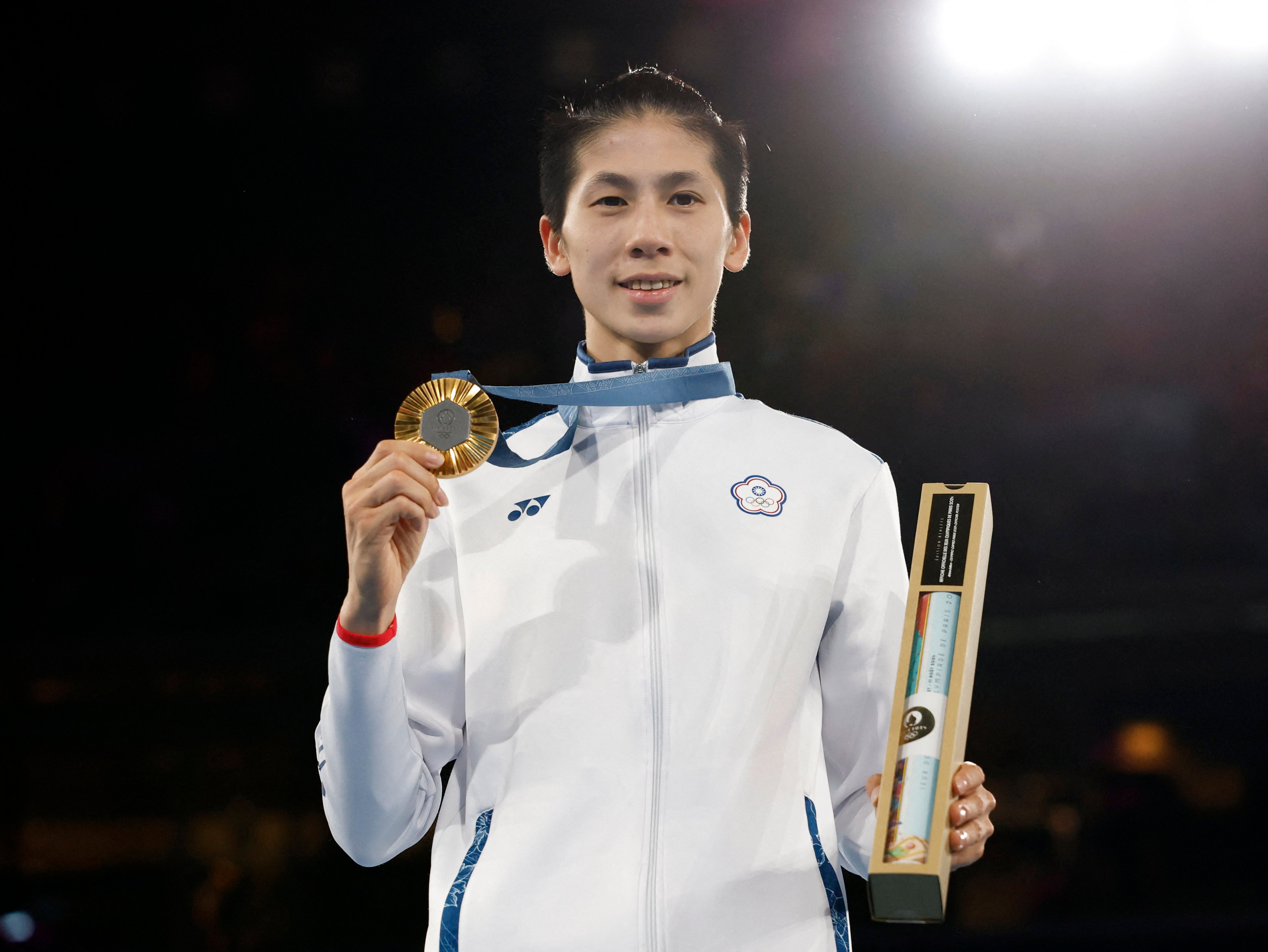 Taiwanese boxer Lin Yu-ting holds her gold medal for the women’s 57kg boxing category at the 2024 Paris Olympics, on August 10, 2024. 