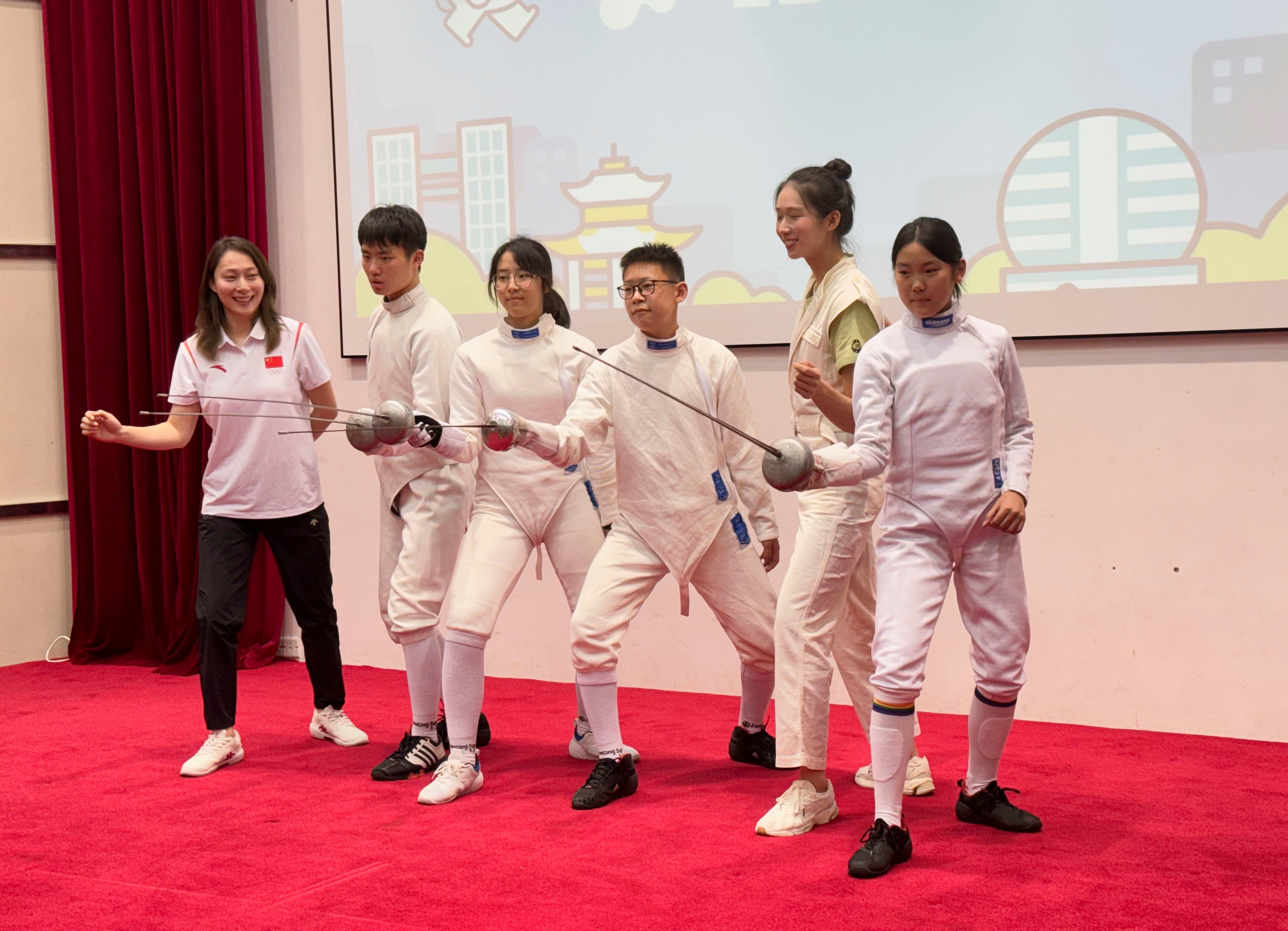 Vivian Kong (second right) poses with fencers from the team at the Hangzhou Chenjinglun Sports School.  Photo: Lo Hoi-ying