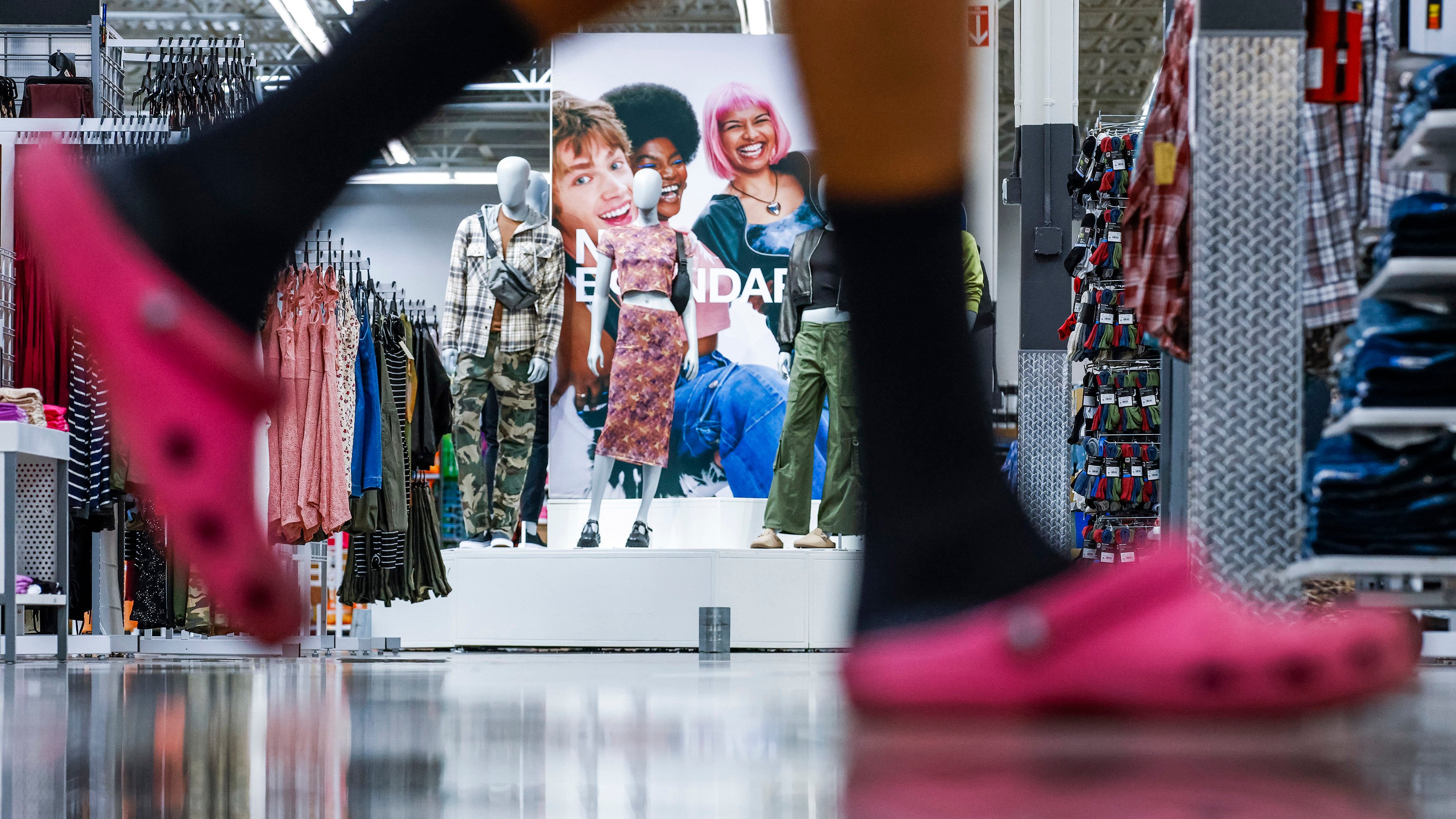 A customer walks by No Boundaries merchandise at a Walmart Superstore in Secaucus, New Jersey, on July 11. In the hope of resonating with younger members of Generation Z, Walmart has revamped its 30-year-old brand for teenagers and young adults. Photo: AP