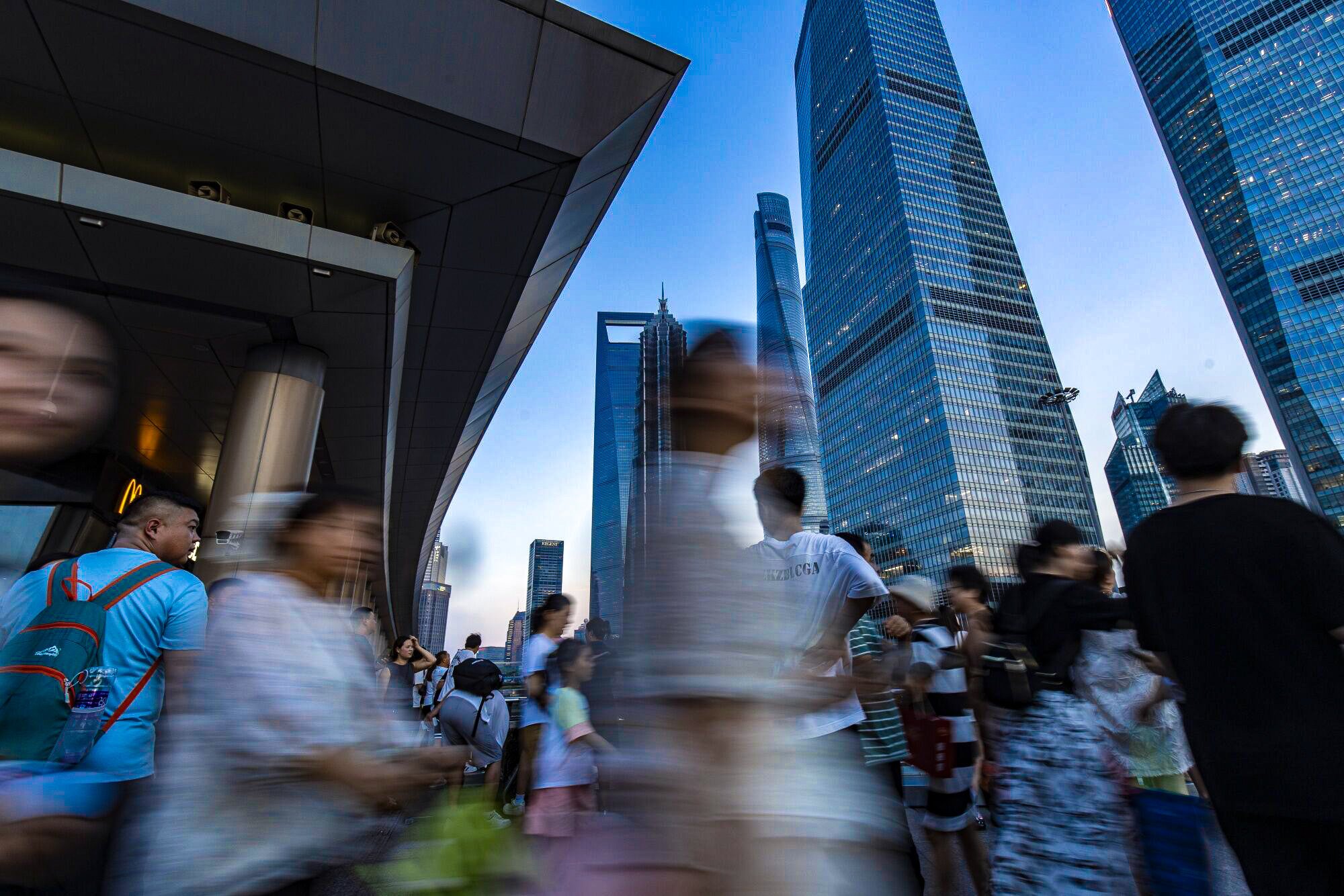 Pedestrians move through Pudong’s Lujiazui Financial District in Shanghai on August 7, 2024. Photo: Bloomberg