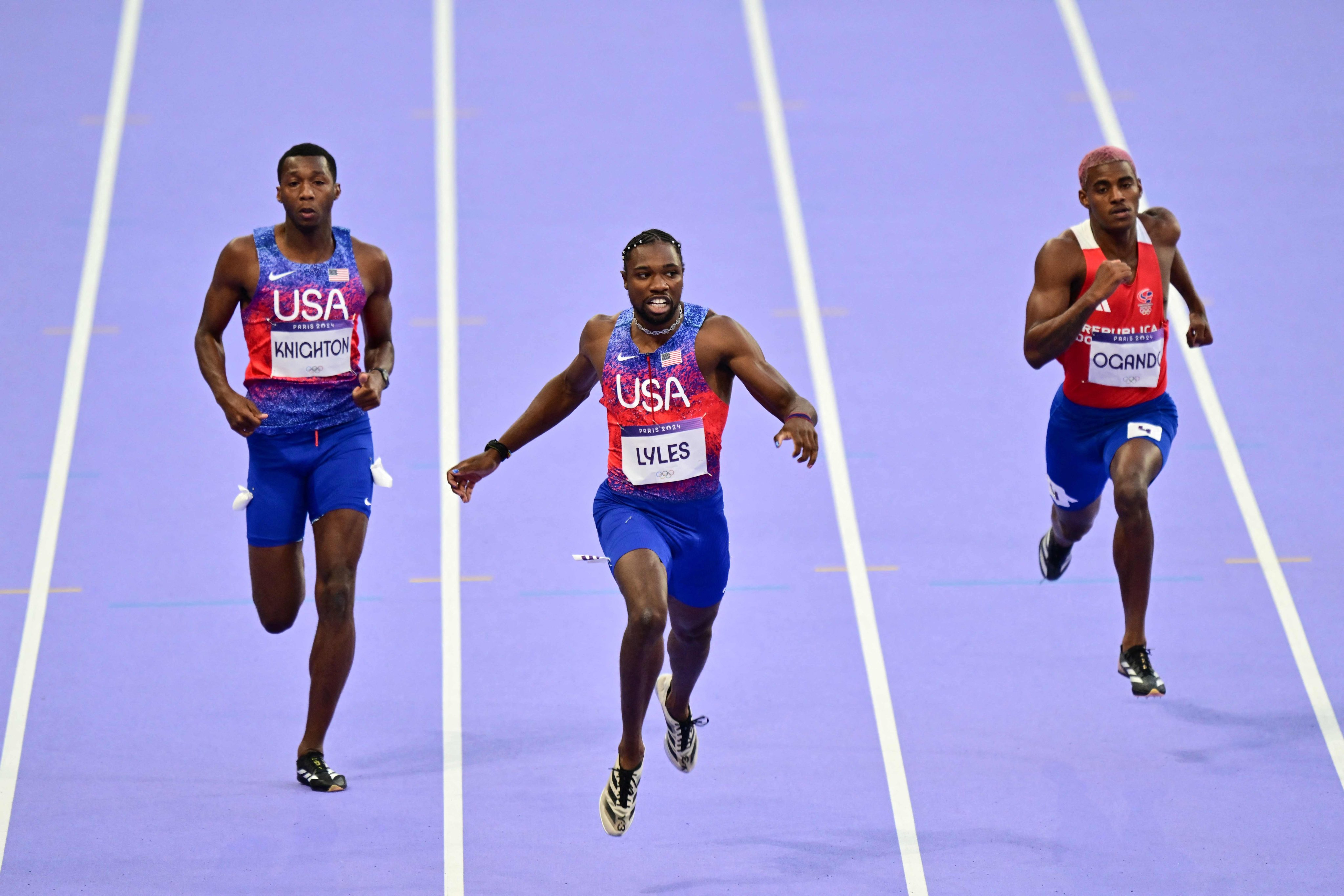 Erriyon Knighton (left), Noah Lyles and Alexander Ogando (right) compete in the men’s 200m final at the Paris Olympics. Photo: AFP