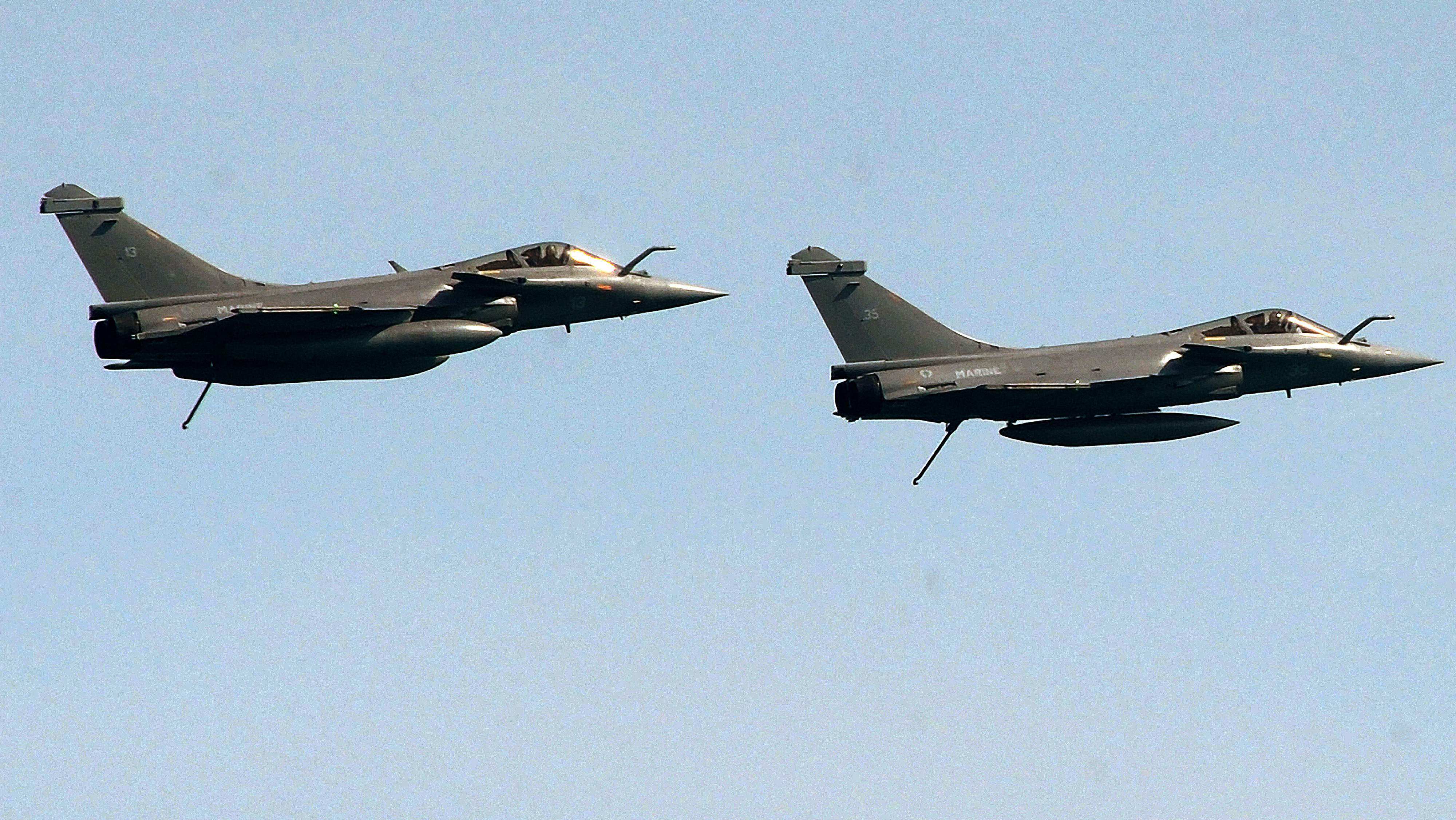 Two French Rafales fighters fly during an international military exercise with the Indian navy off the coast of France in May 2017. Photo: AFP