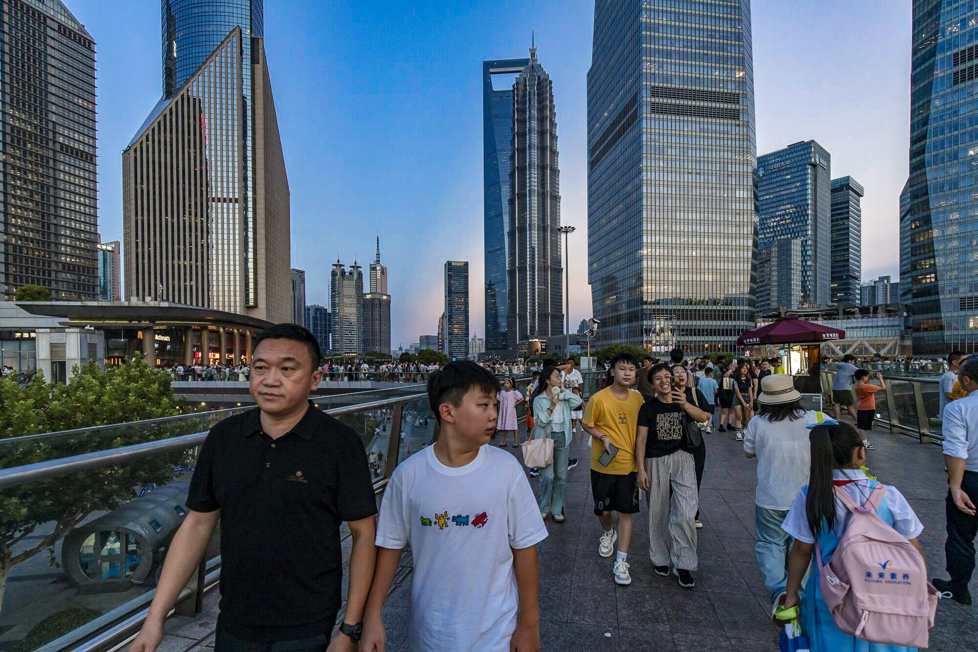 Pedestrians stroll in Pudong’s Lujiazui Financial District in Shanghai on August 7, 2024. Photo: Bloomberg