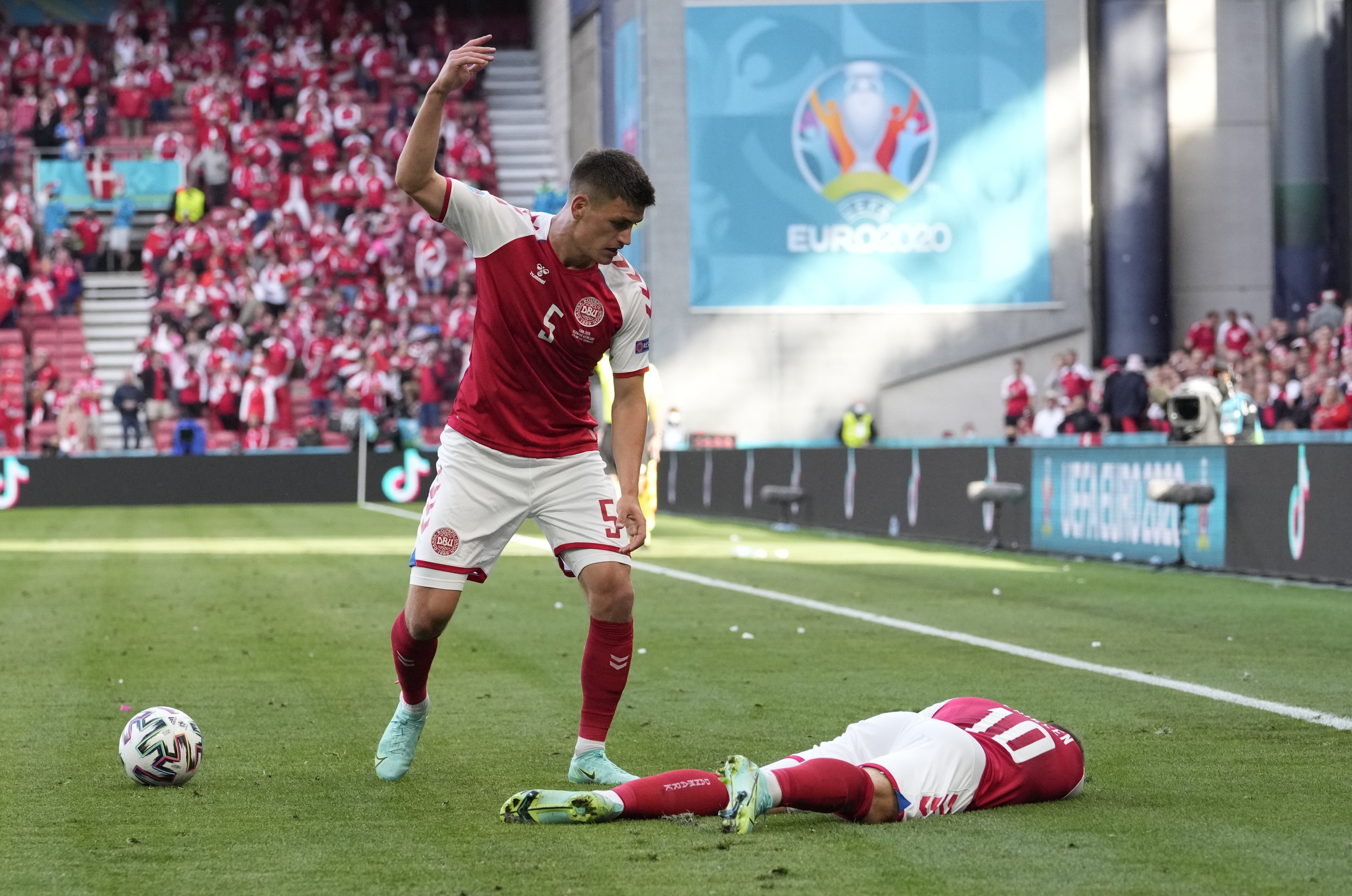 Denmark’s Christian Eriksen lies on the pitch after suffering a sudden cardiac arrest during the Euro 2020 soccer match between Denmark and Finland on June 12, 2021. Photo: AP