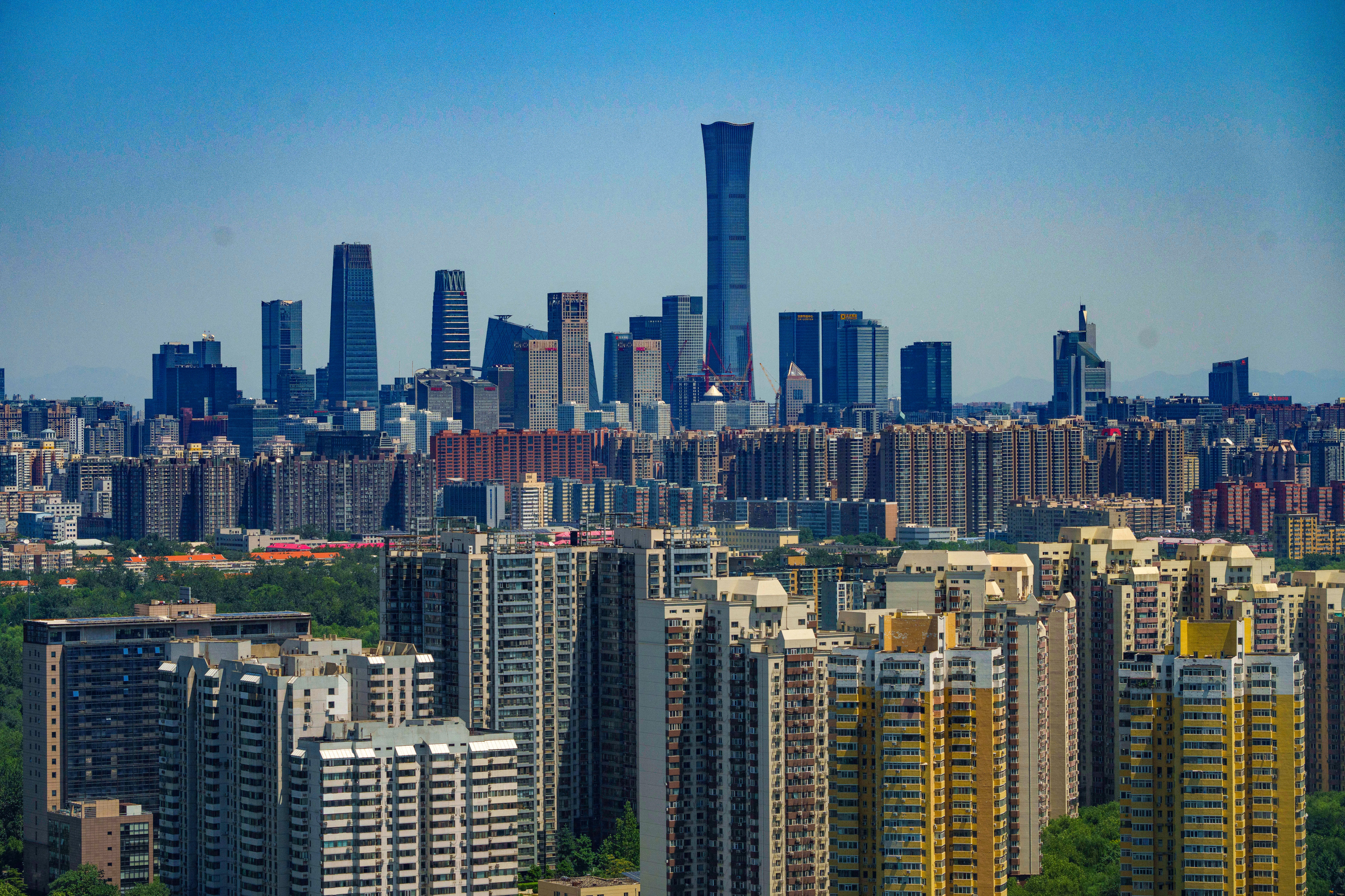 A view of the skyline of central Beijing, with housing developments in the foreground, on July 17, 2024. Photo: AP